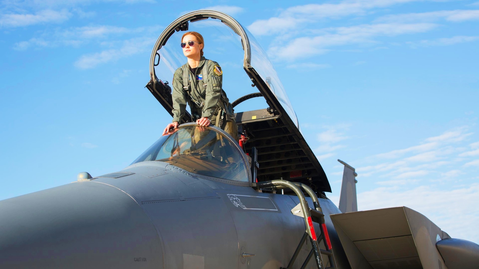 Brie Larson as Captain Marvel in a fighter jet HD Wallpaper