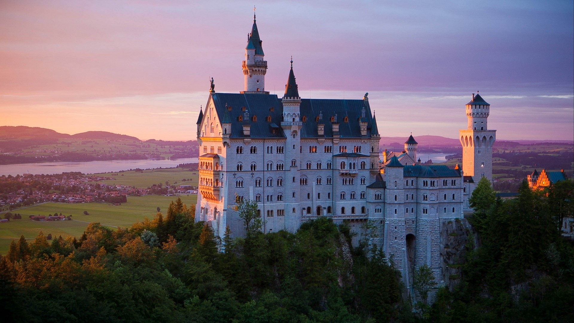 Neuschwanstein Castle at sunset HD Wallpaper