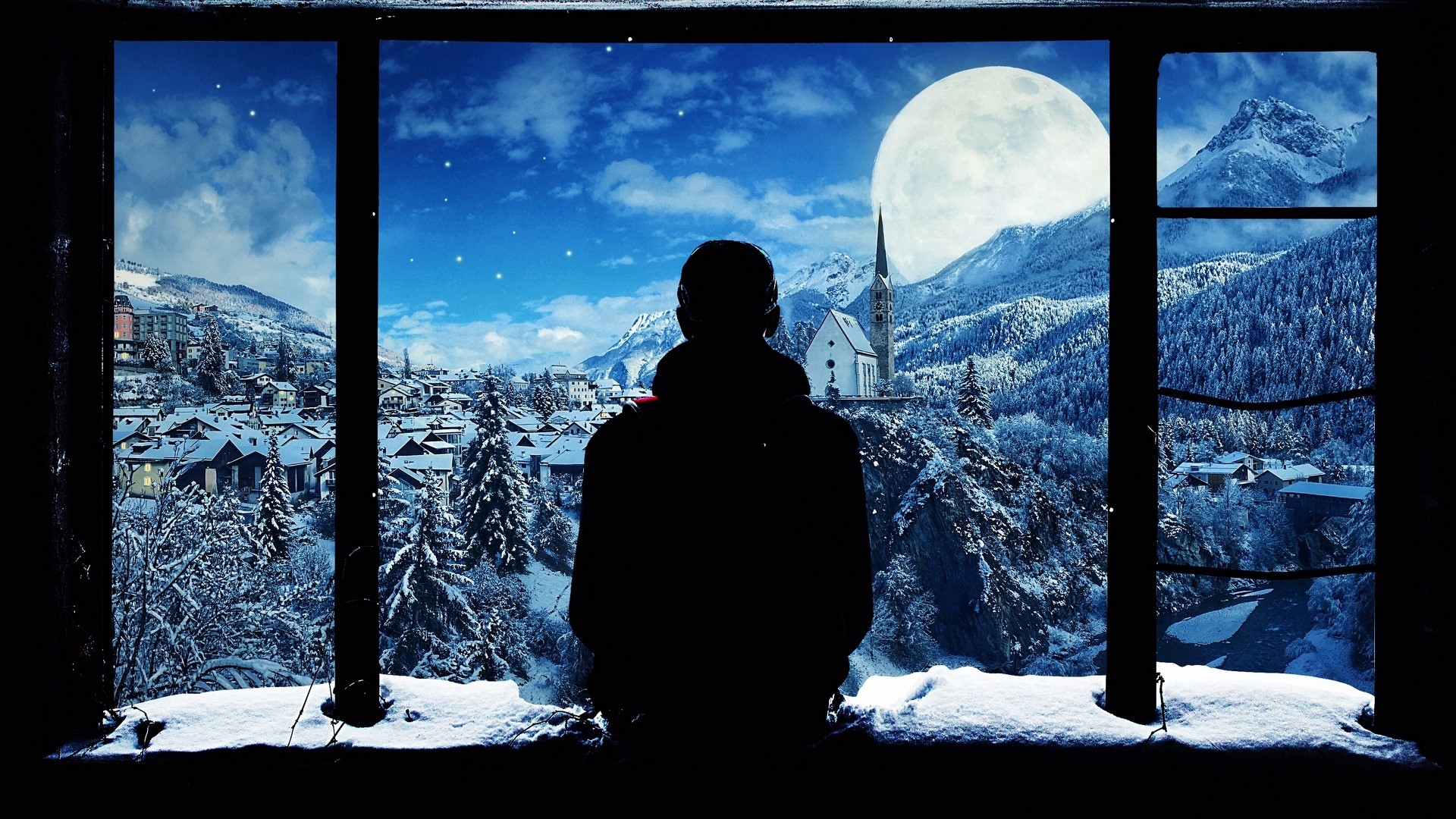 Silhouette of a person looking out a window at a snowy village and mountains HD Wallpaper