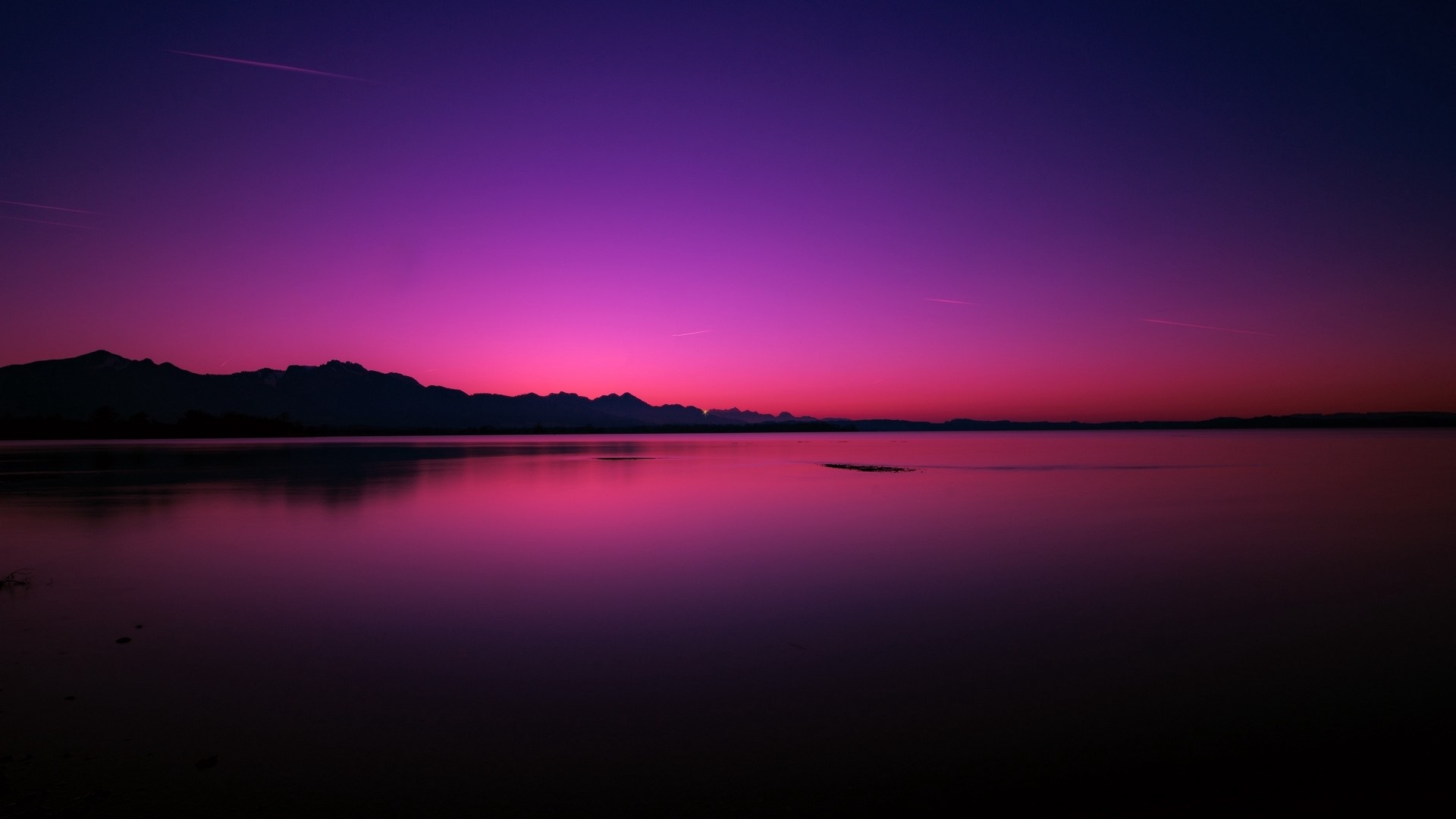 Purple sunset over a lake with mountains HD Wallpaper