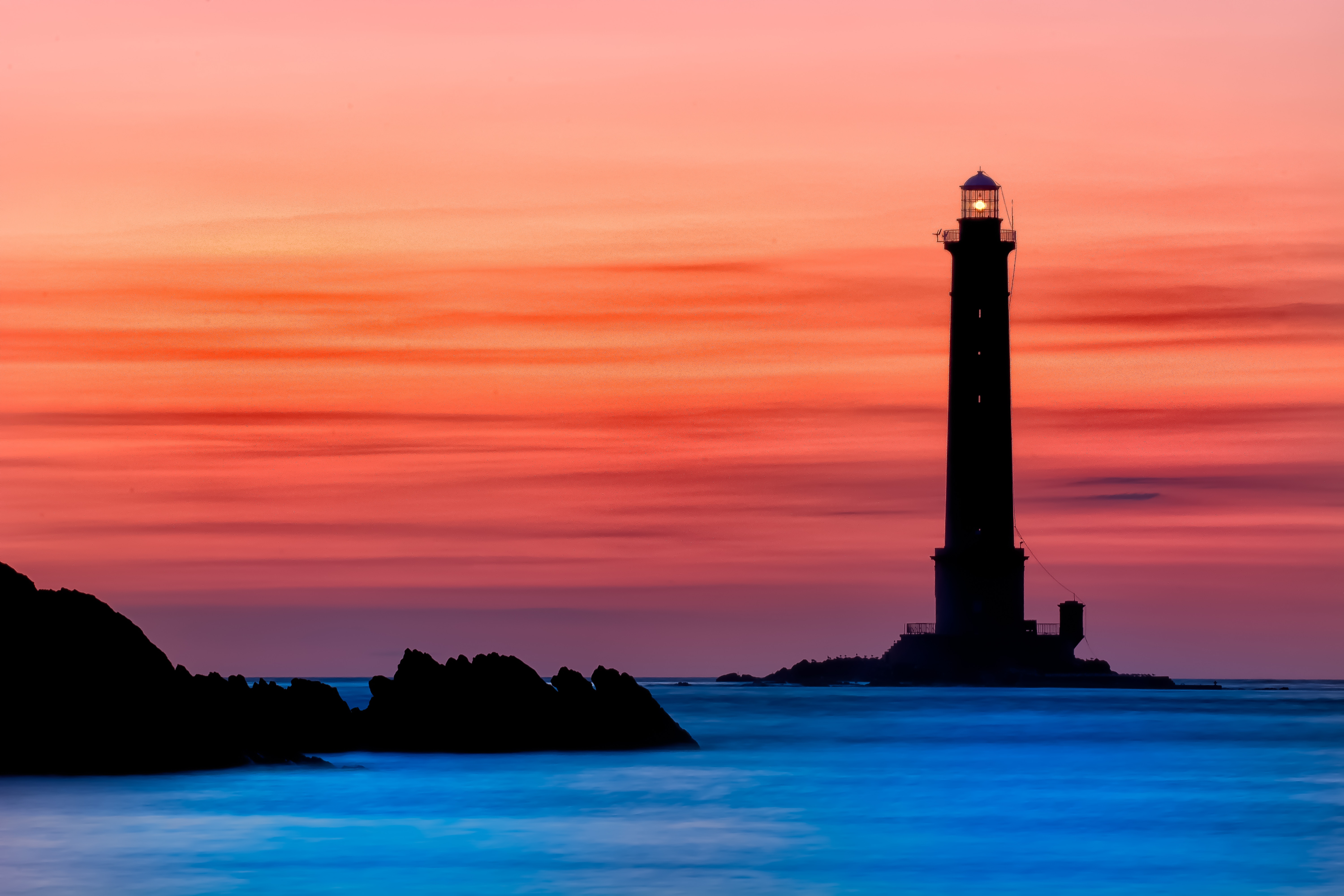 Lighthouse at Cap de la Hague during sunset HD Wallpaper