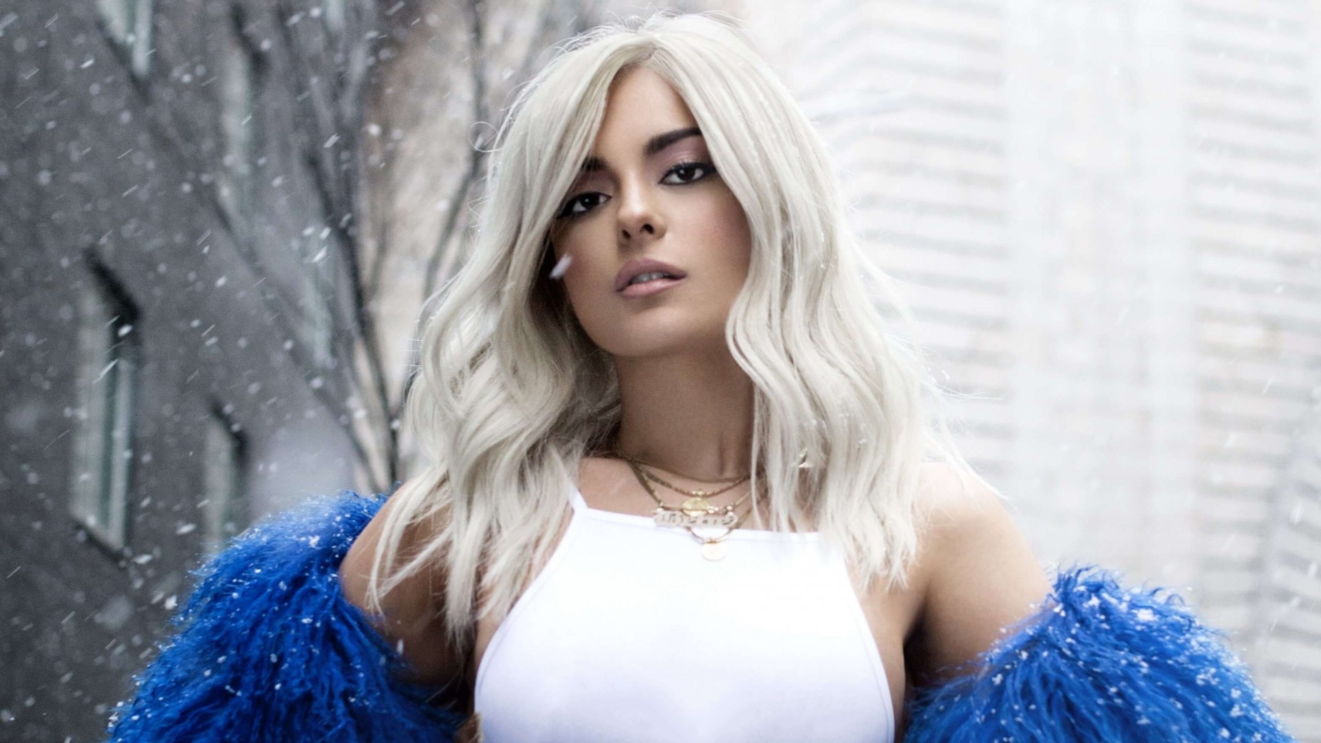 Bebe Rexha in a blue fur coat in the snow HD Wallpaper