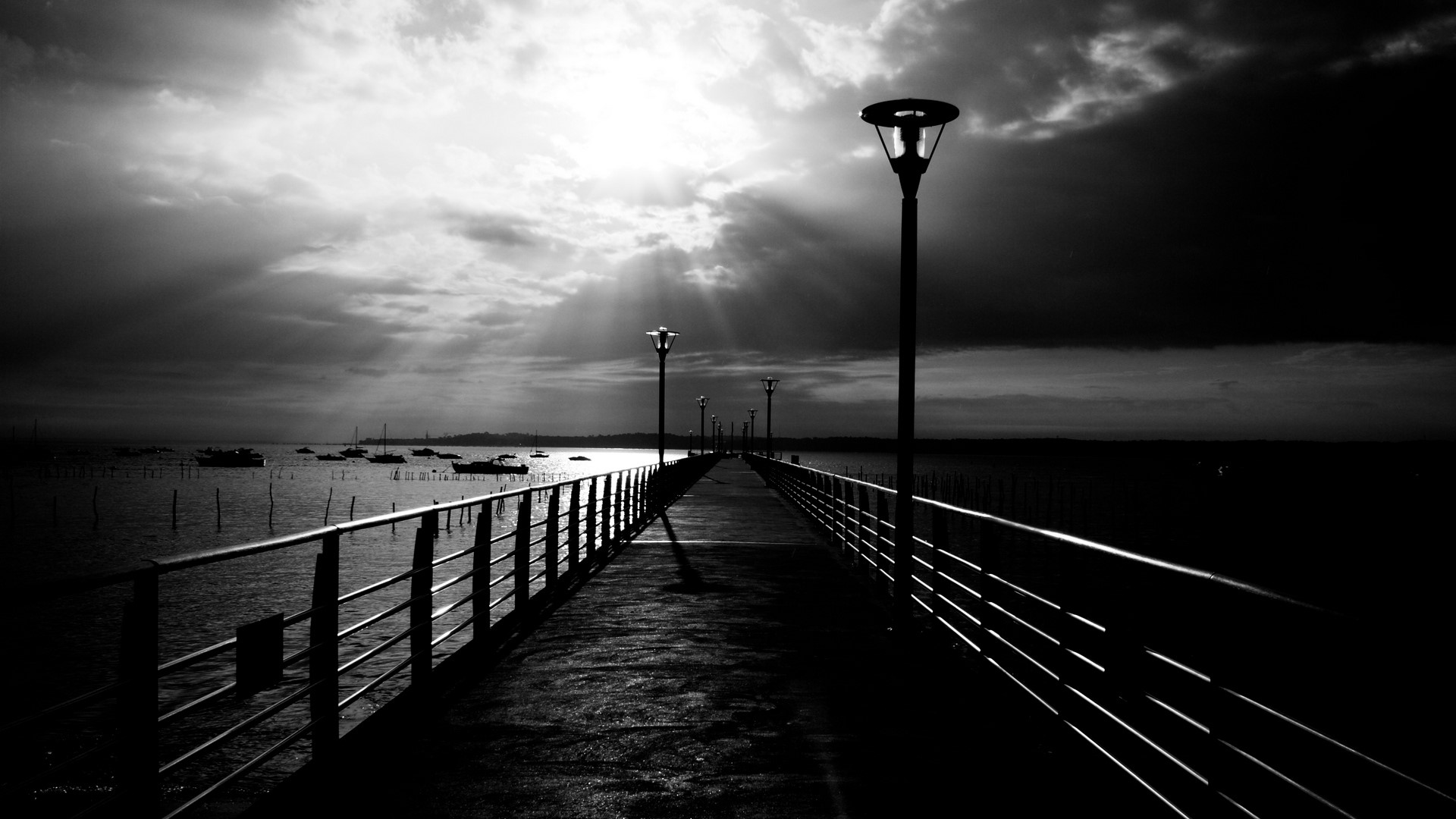 Pier with streetlights over water HD Wallpaper