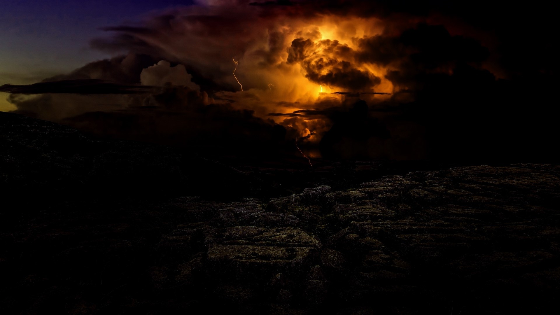 Lightning storm over rocky terrain HD Wallpaper