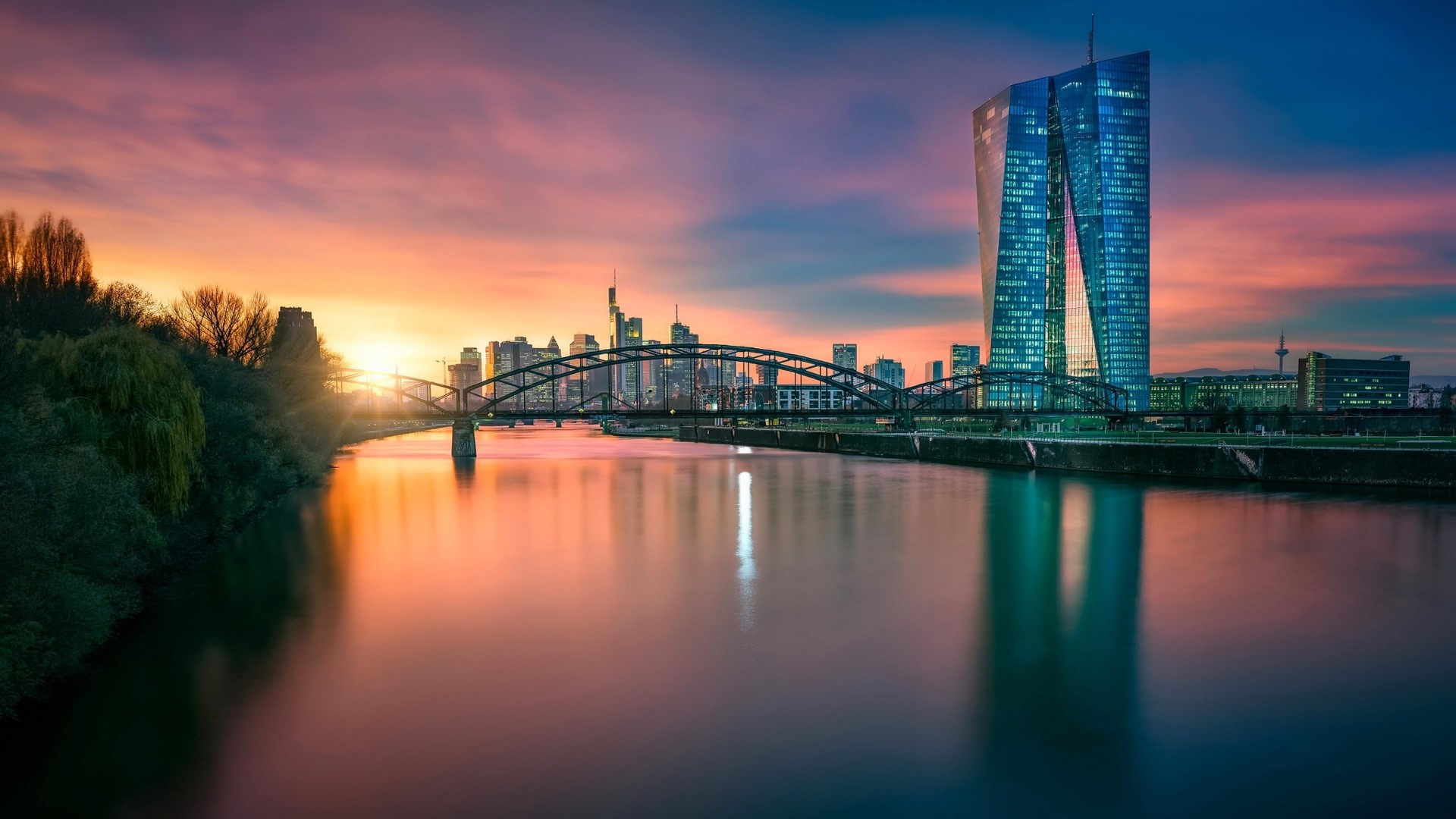 Frankfurt skyline with bridge and river at sunset HD Wallpaper