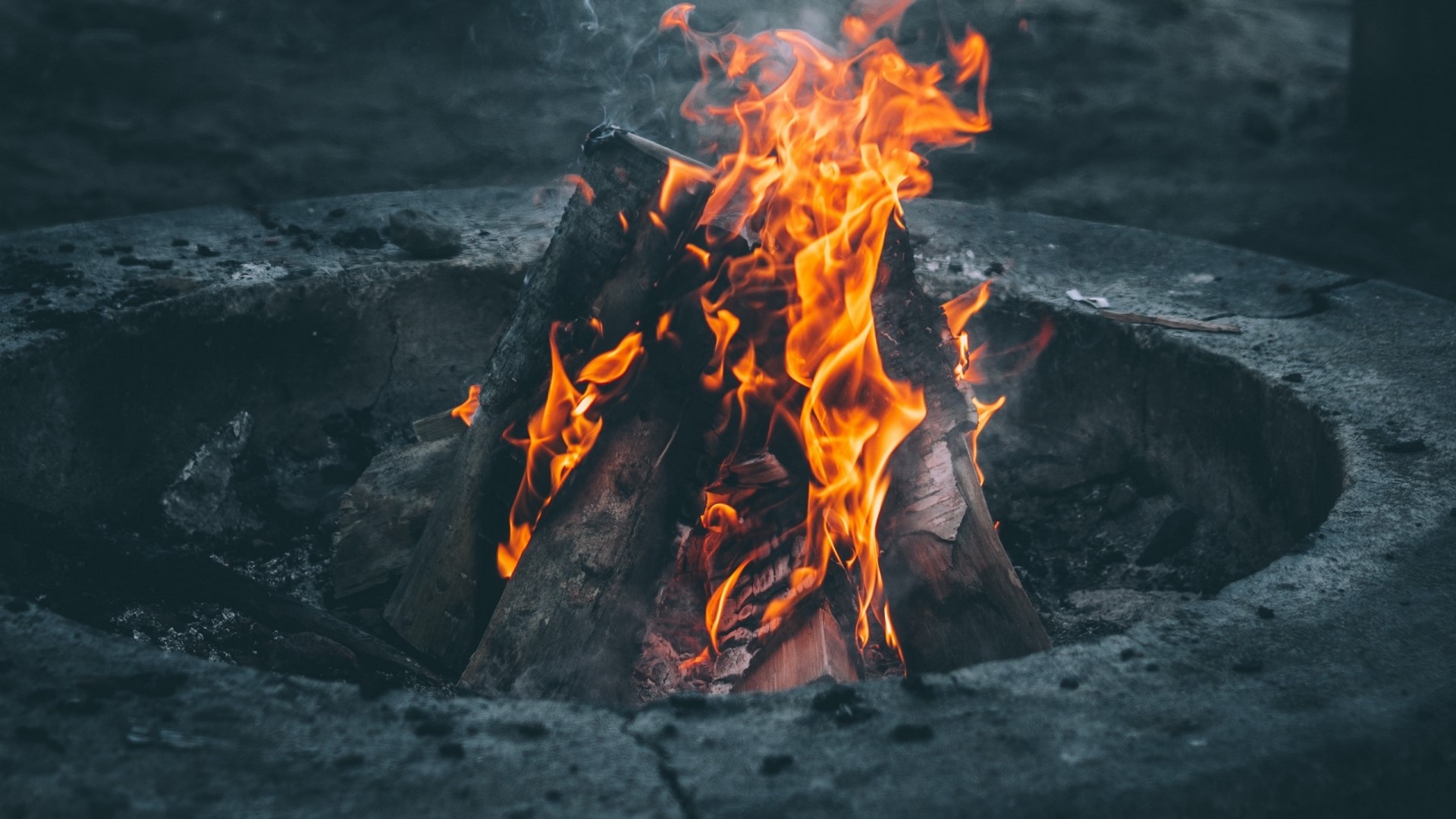 Bonfire in a stone fire pit HD Wallpaper
