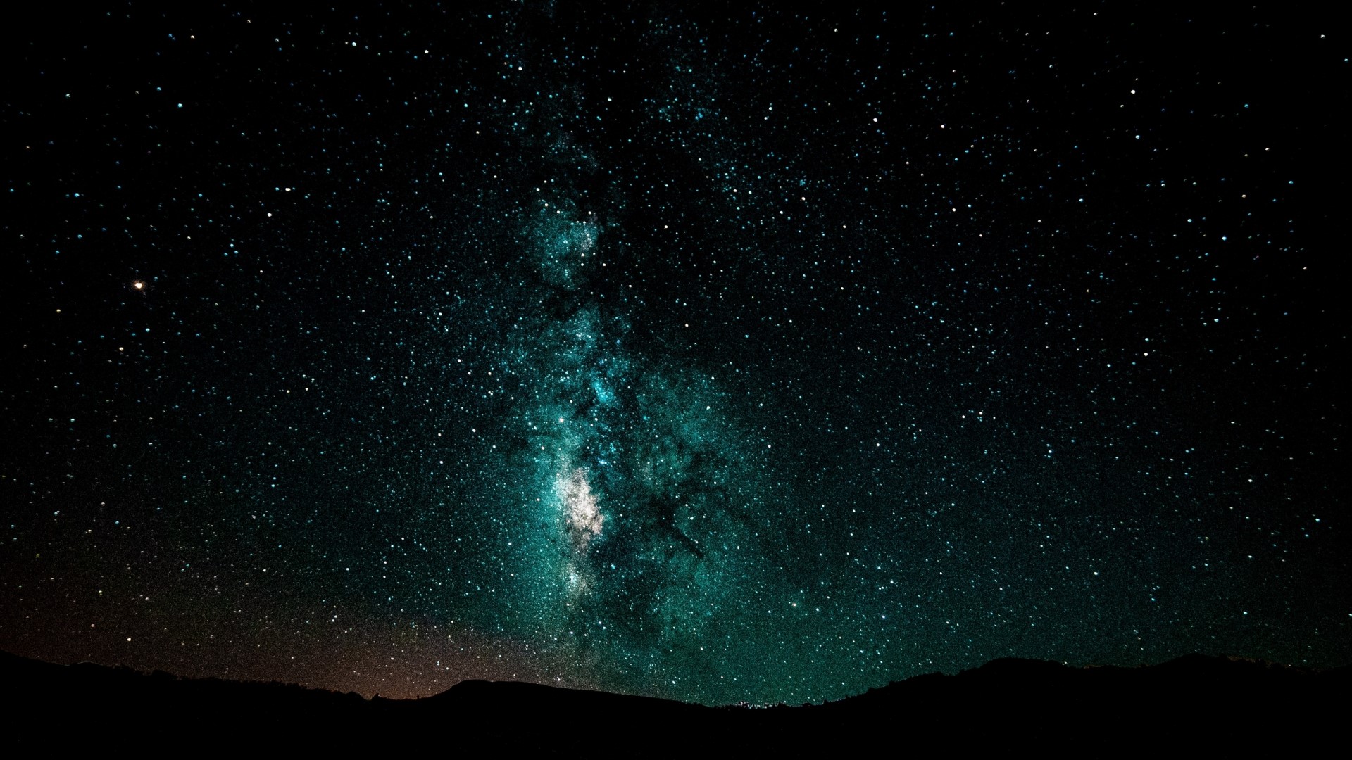 Starry night sky over silhouette of hills HD Wallpaper