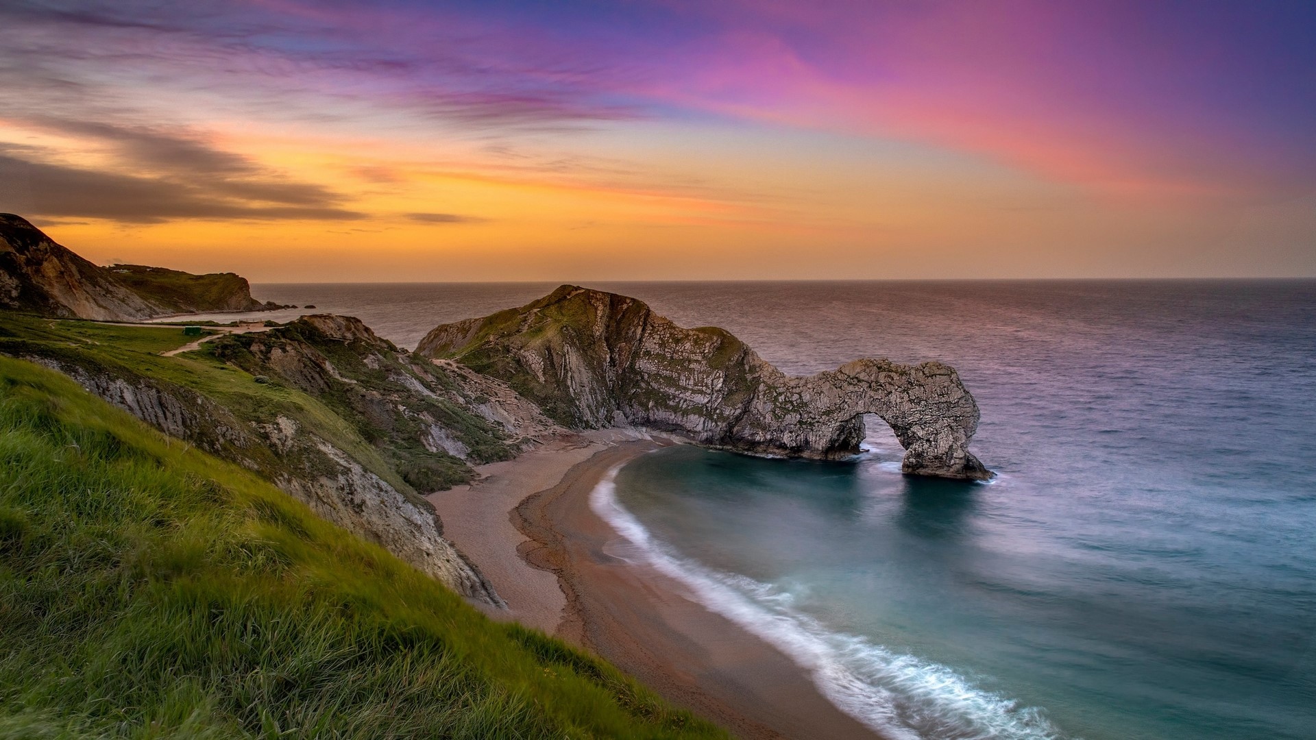 Durdle Door rock arch at sunset HD Wallpaper