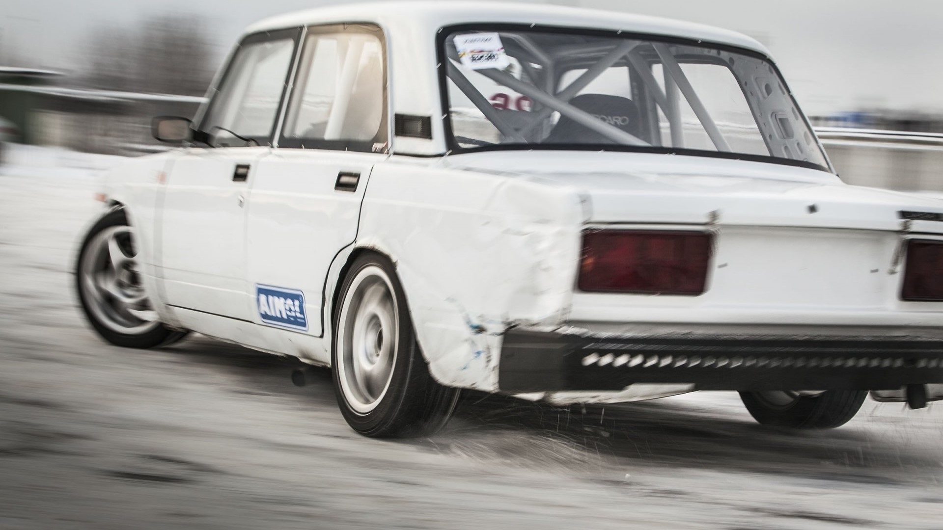 White drift car on a snowy track HD Wallpaper