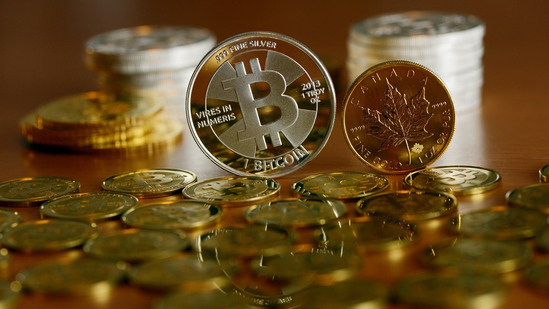 Bitcoin and Canadian Maple Leaf coins HD Wallpaper