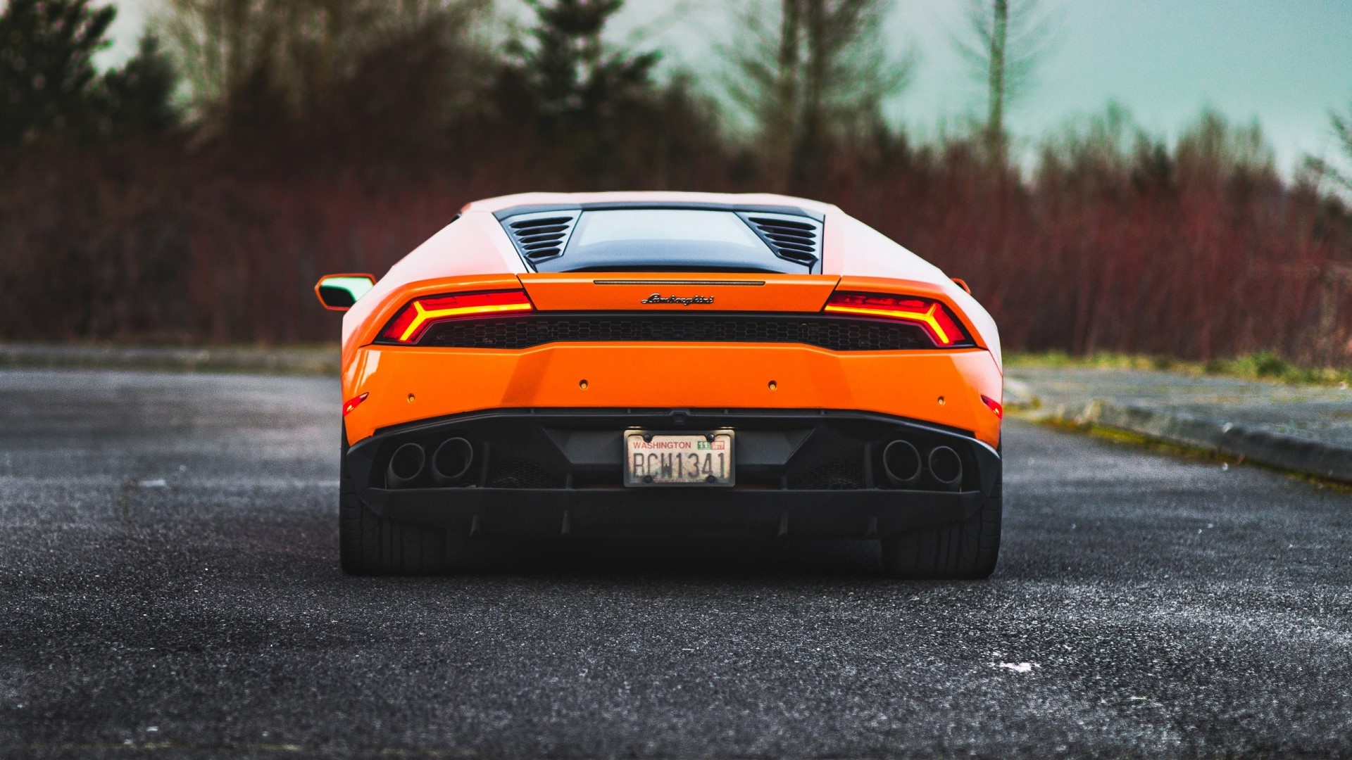 Orange Lamborghini Huracan rear view HD Wallpaper