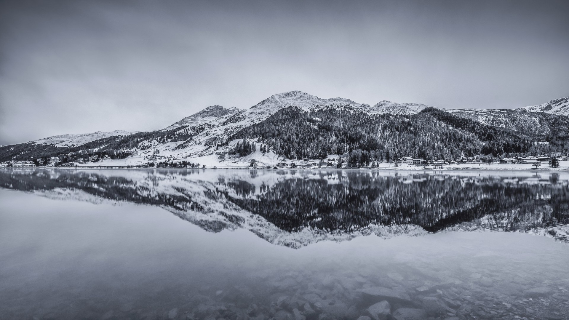 Lake Davos in Switzerland with snow-capped mountains HD Wallpaper