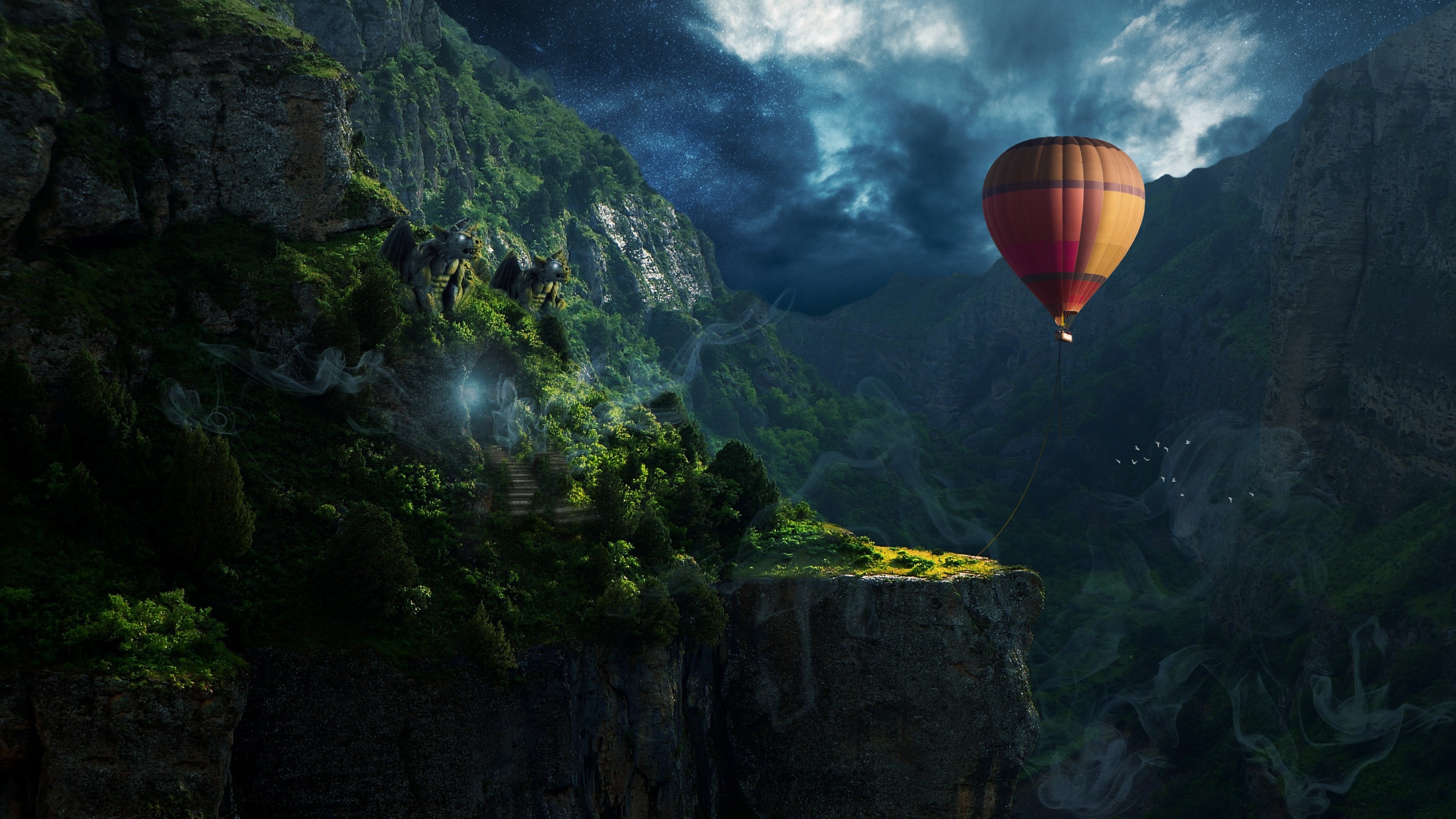 Hot air balloon over a misty canyon HD Wallpaper