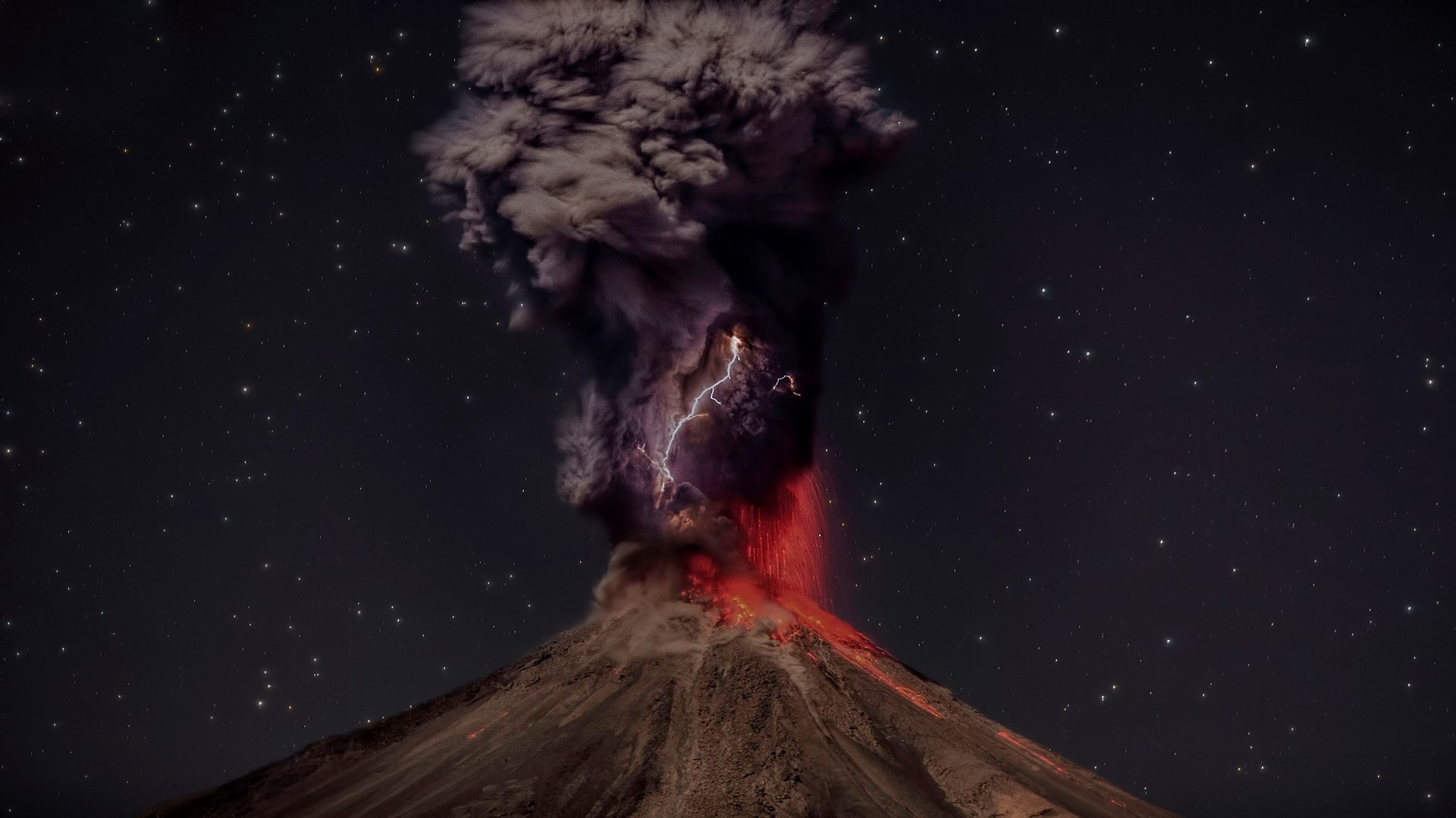 Volcano eruption with lightning at night HD Wallpaper