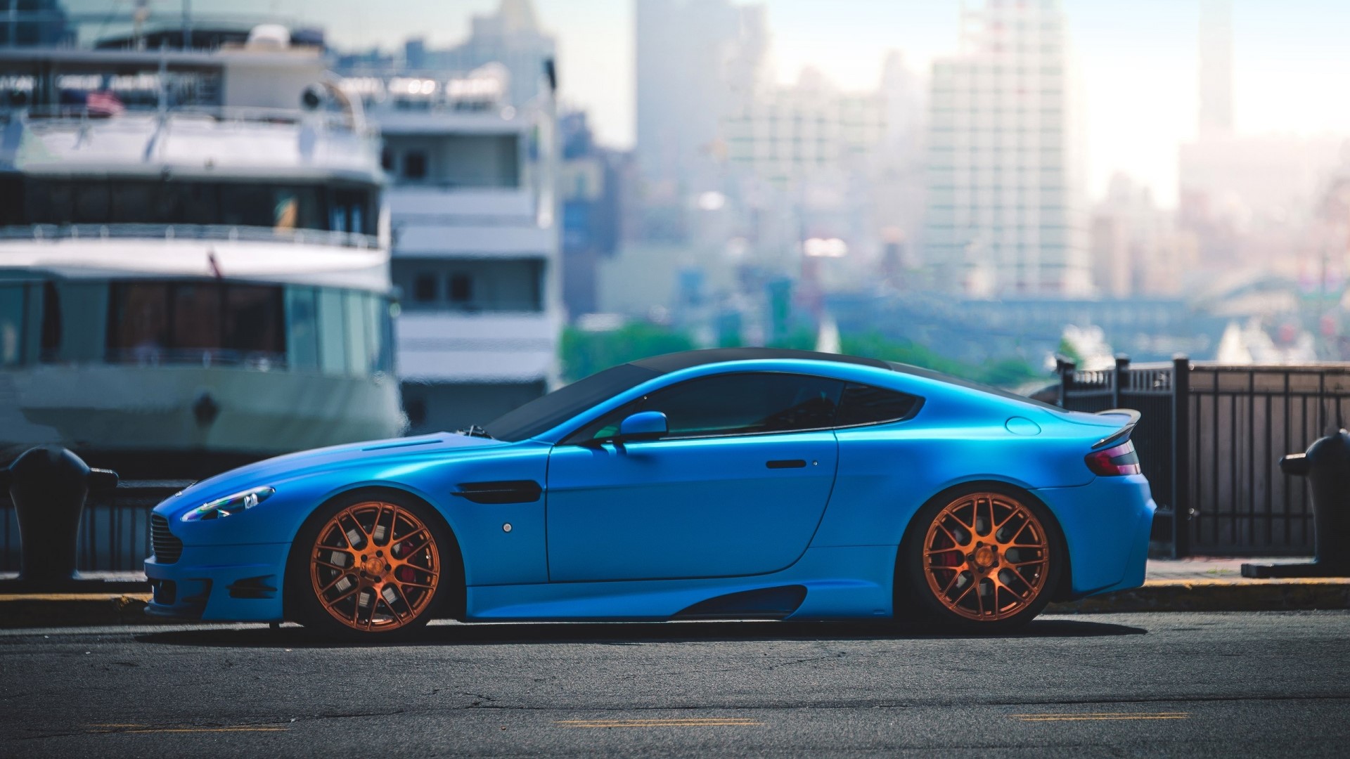 Blue Aston Martin Vantage with orange rims HD Wallpaper