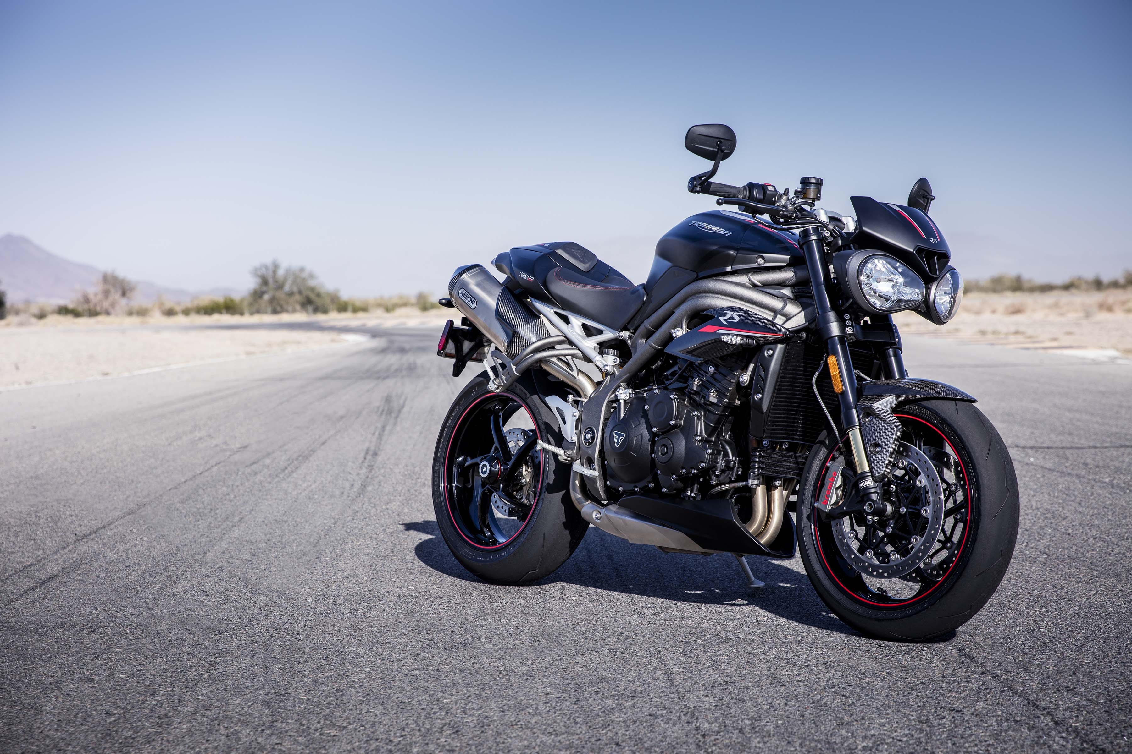 Triumph Speed Triple RS motorcycle on a road HD Wallpaper