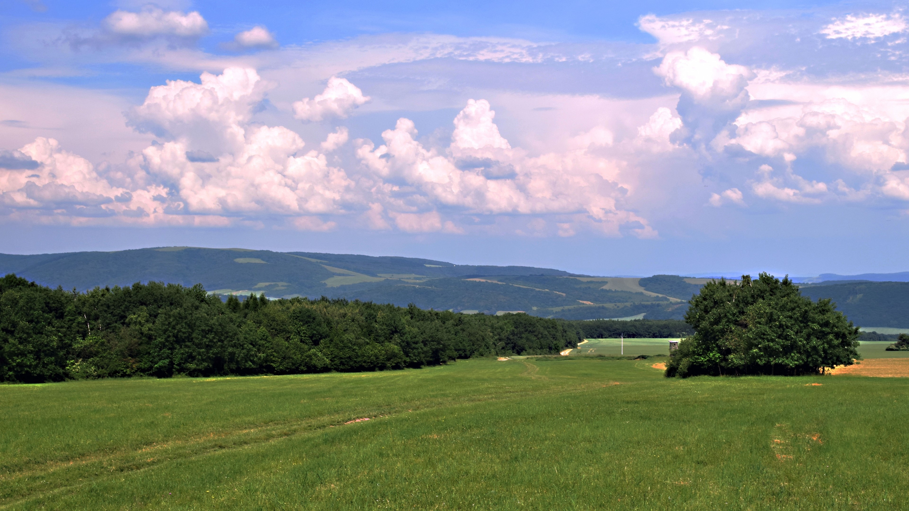 4K Nature Landscape with Rolling Hills and Clouds HD Wallpaper