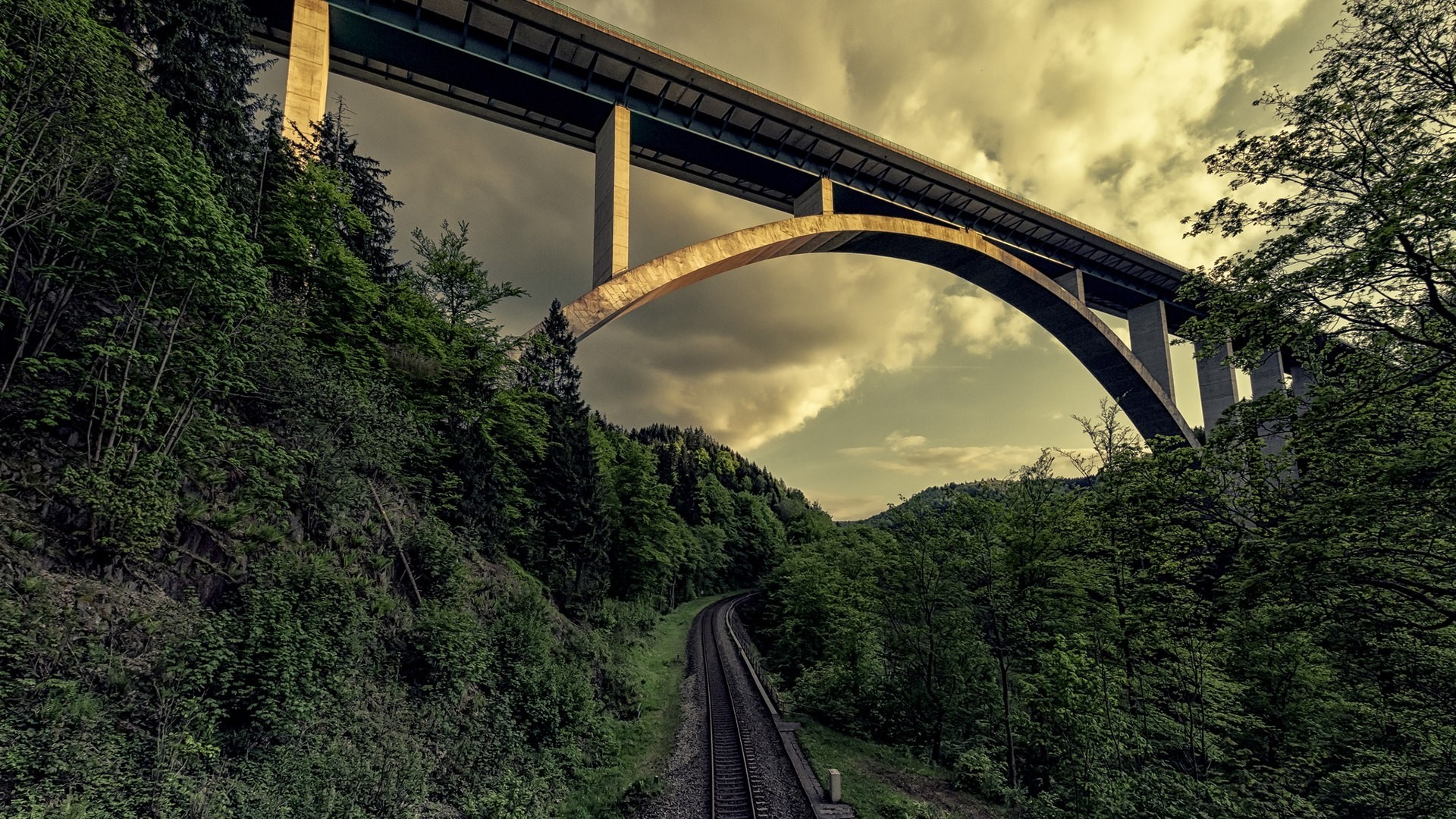 Viaduct over a forest and railway HD Wallpaper