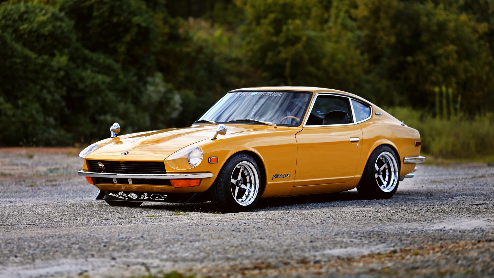 Yellow Datsun 240Z parked on gravel HD Wallpaper