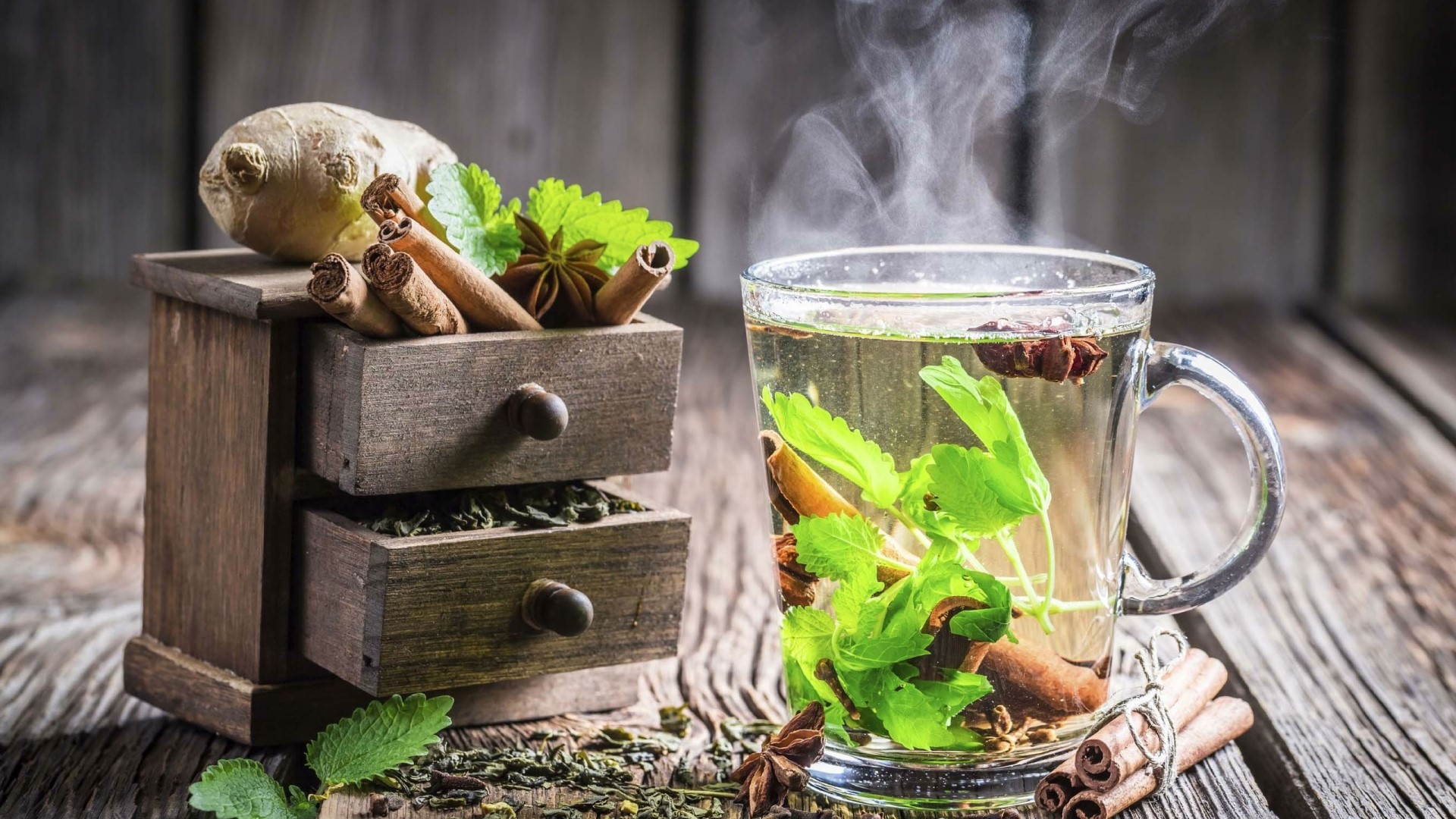 Steaming cup of herbal tea with ginger and cinnamon HD Wallpaper