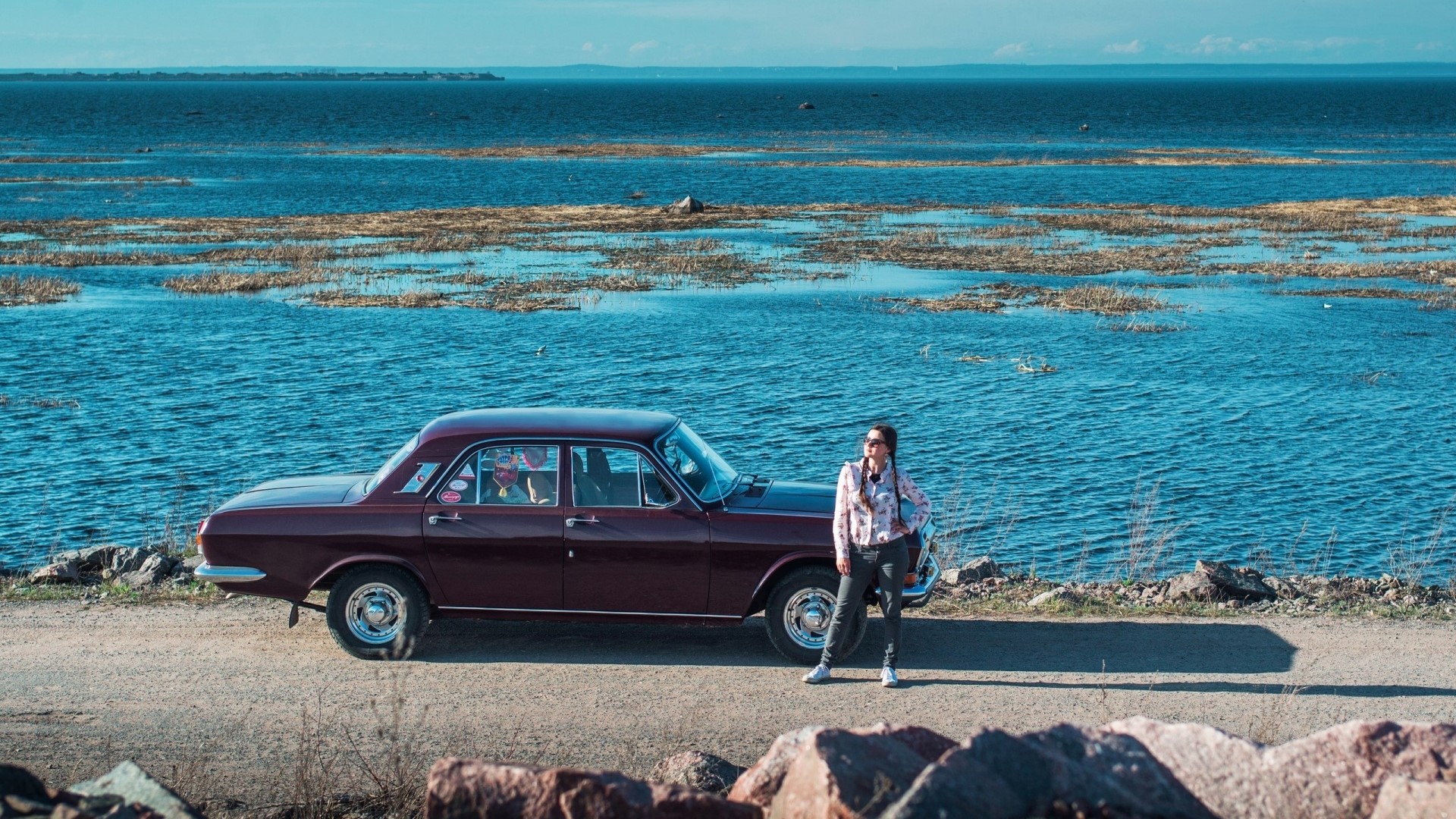 Woman and vintage car by the sea HD Wallpaper