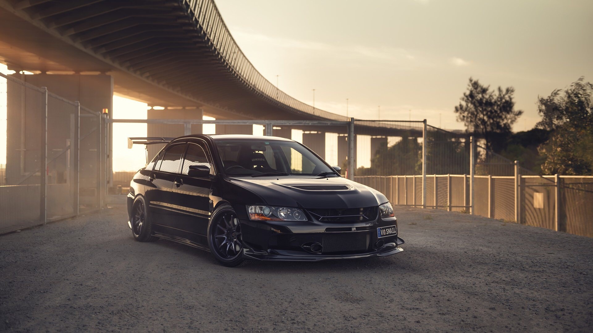 Black Mitsubishi Lancer Evolution under a bridge HD Wallpaper