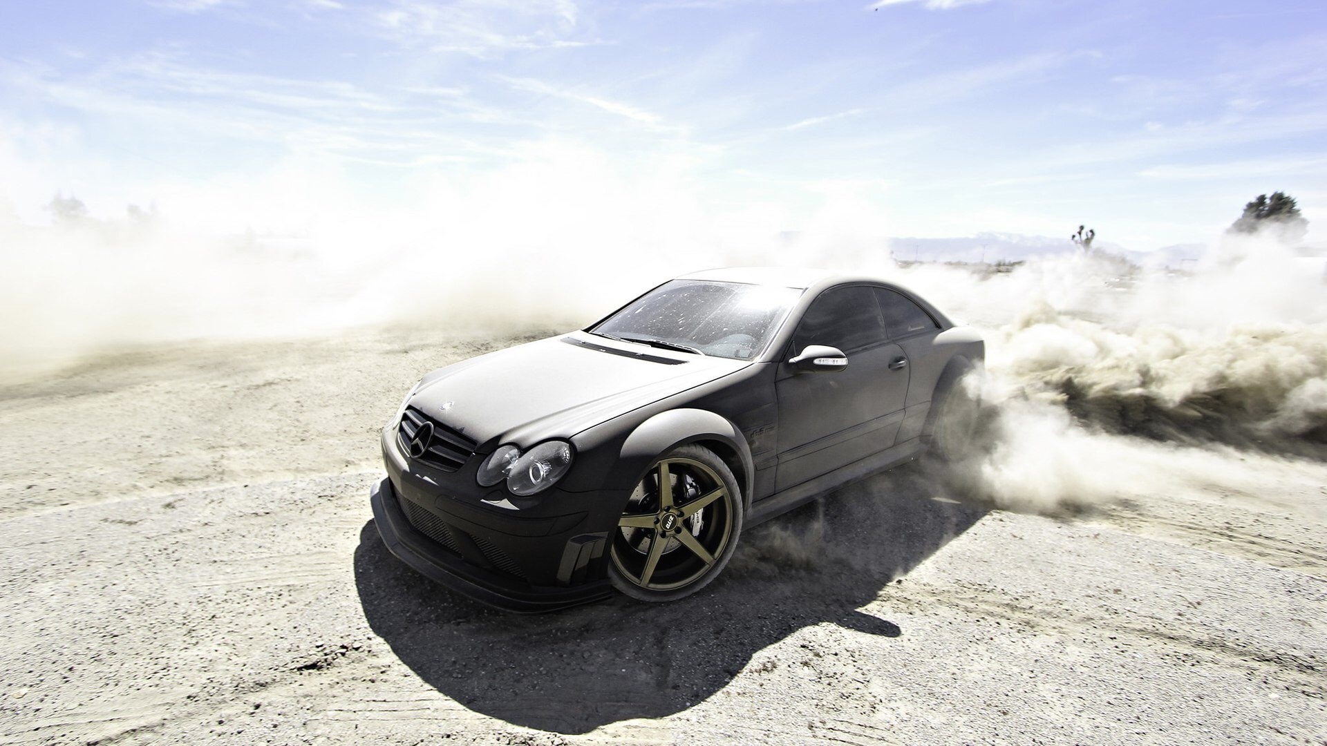 Mercedes-Benz CLK 63 AMG Black Series drifting in dust HD Wallpaper