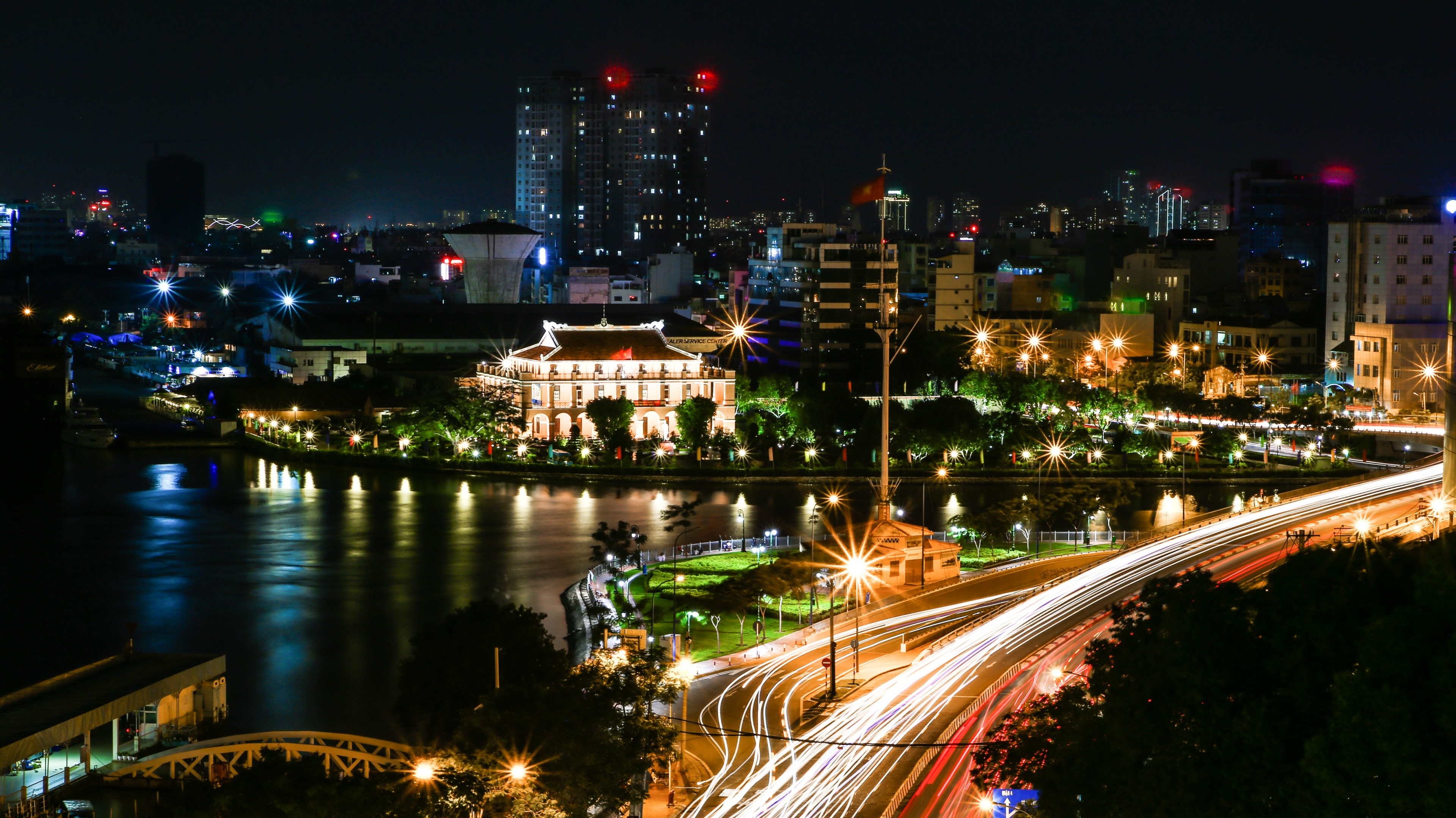 4K Vietnam Cityscape at Night with River and Bridge HD Wallpaper