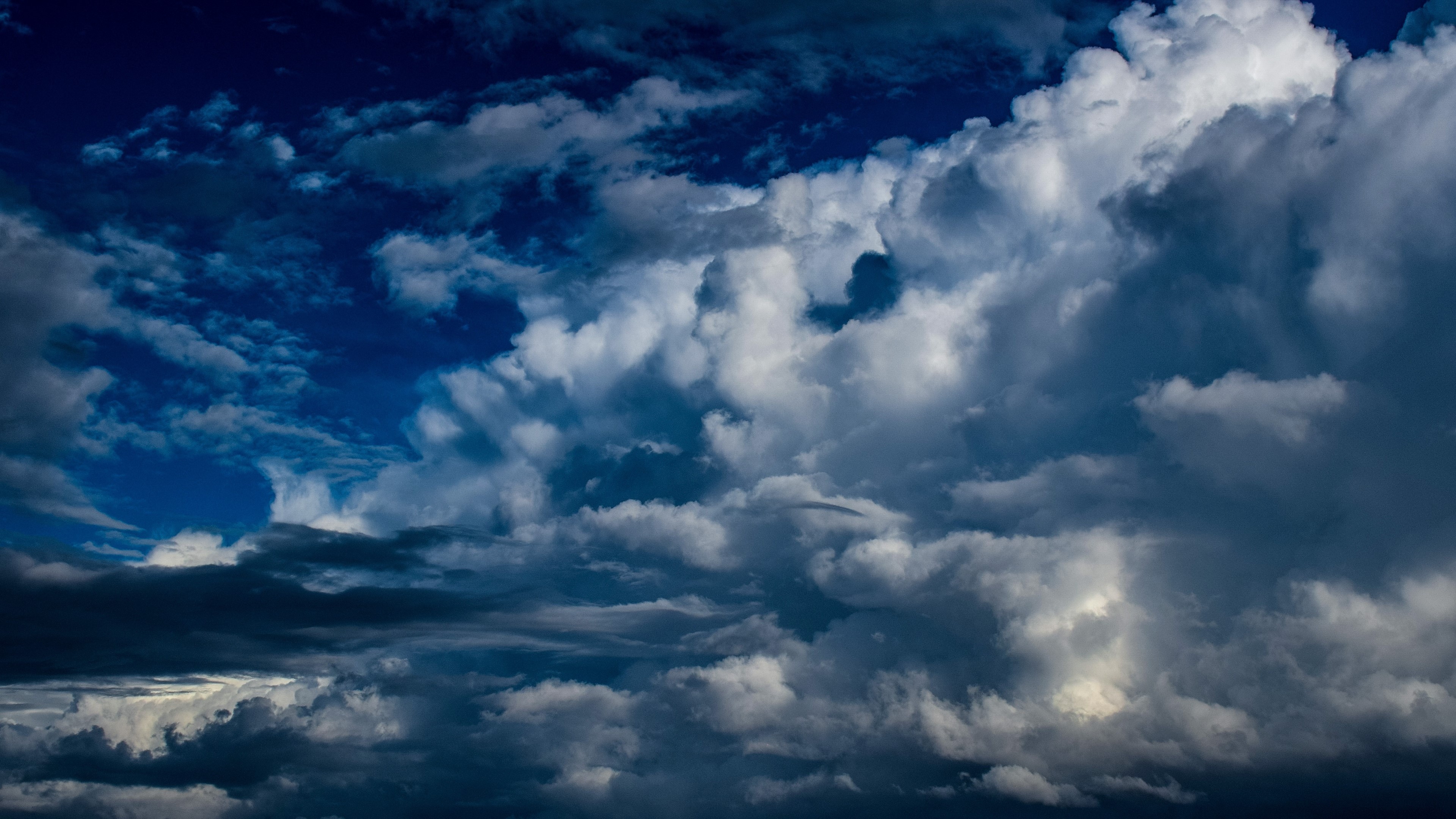 4K Clouds in a Dark Sky HD Wallpaper