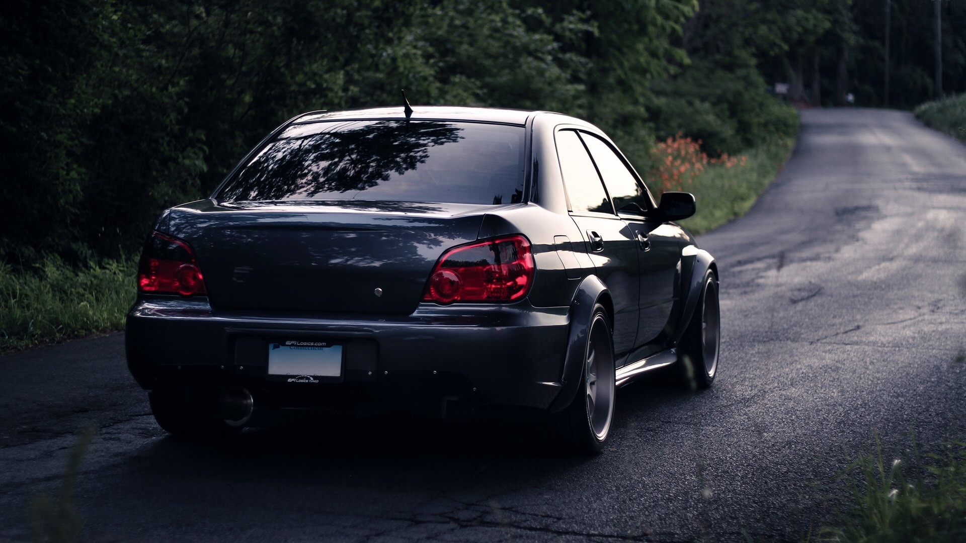 Dark Subaru Impreza on a Winding Road HD Wallpaper
