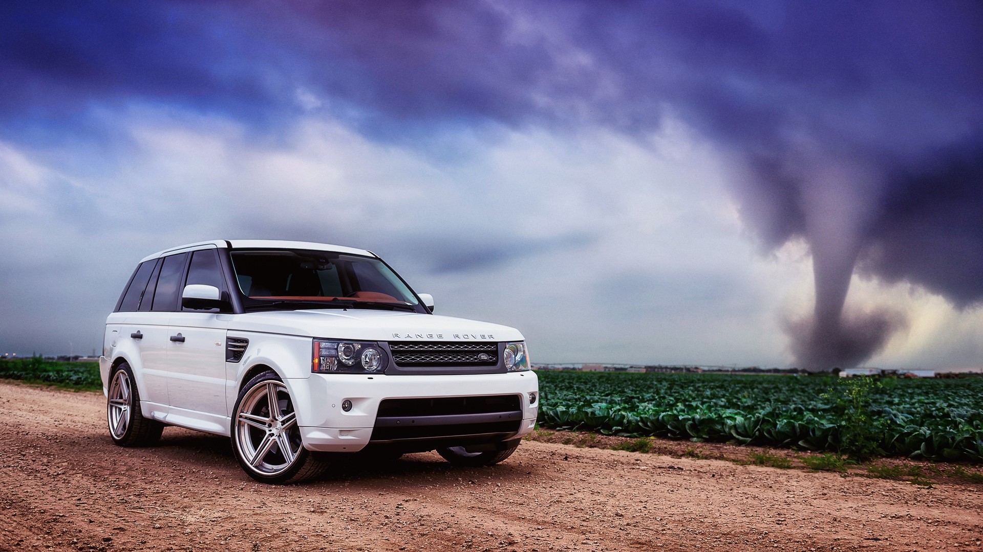 White Range Rover in front of a tornado HD Wallpaper