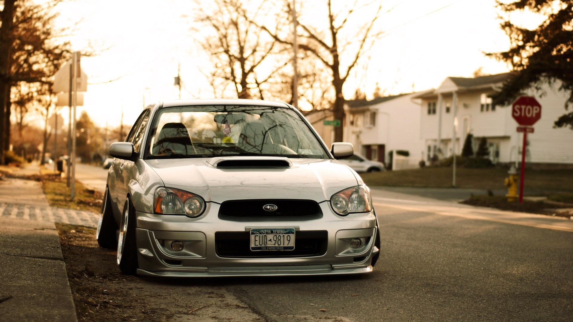 Silver Subaru Impreza parked on a suburban street HD Wallpaper