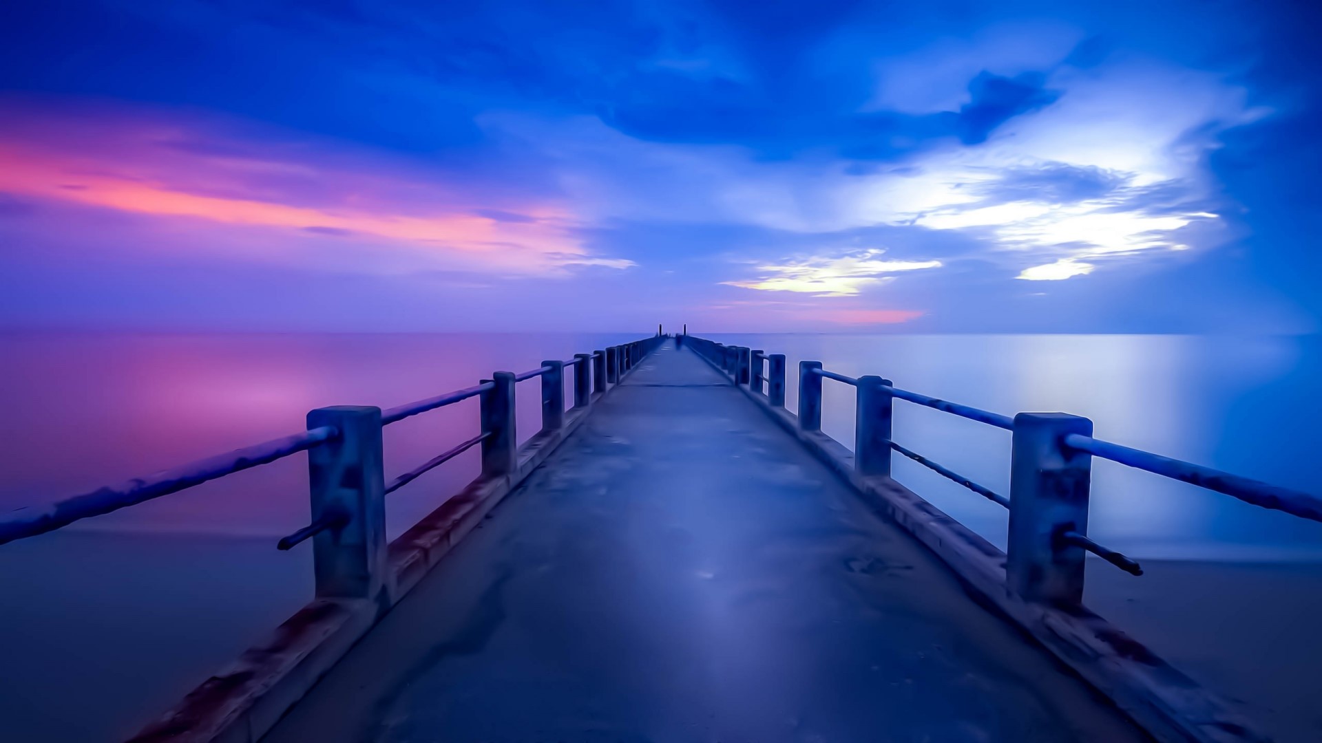 Pier over the ocean at sunset HD Wallpaper