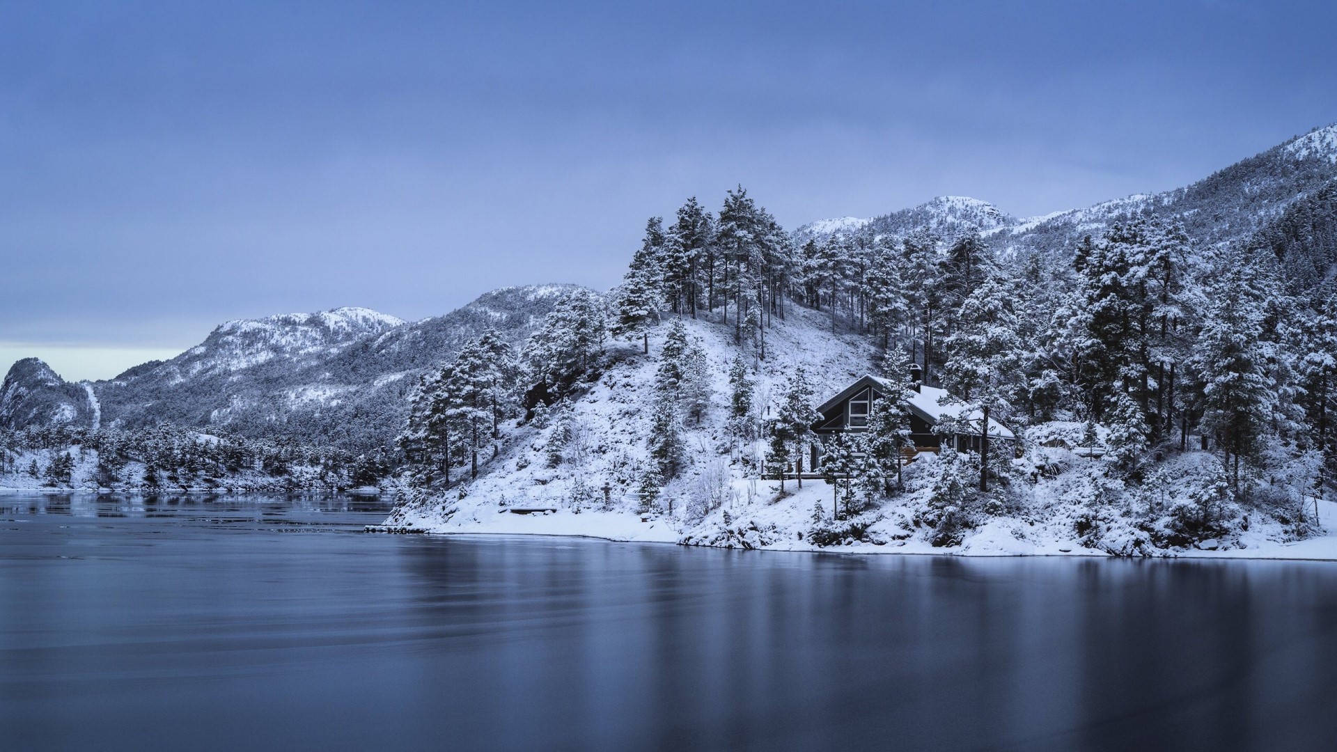 Snowy cabin by a lake in Norway HD Wallpaper