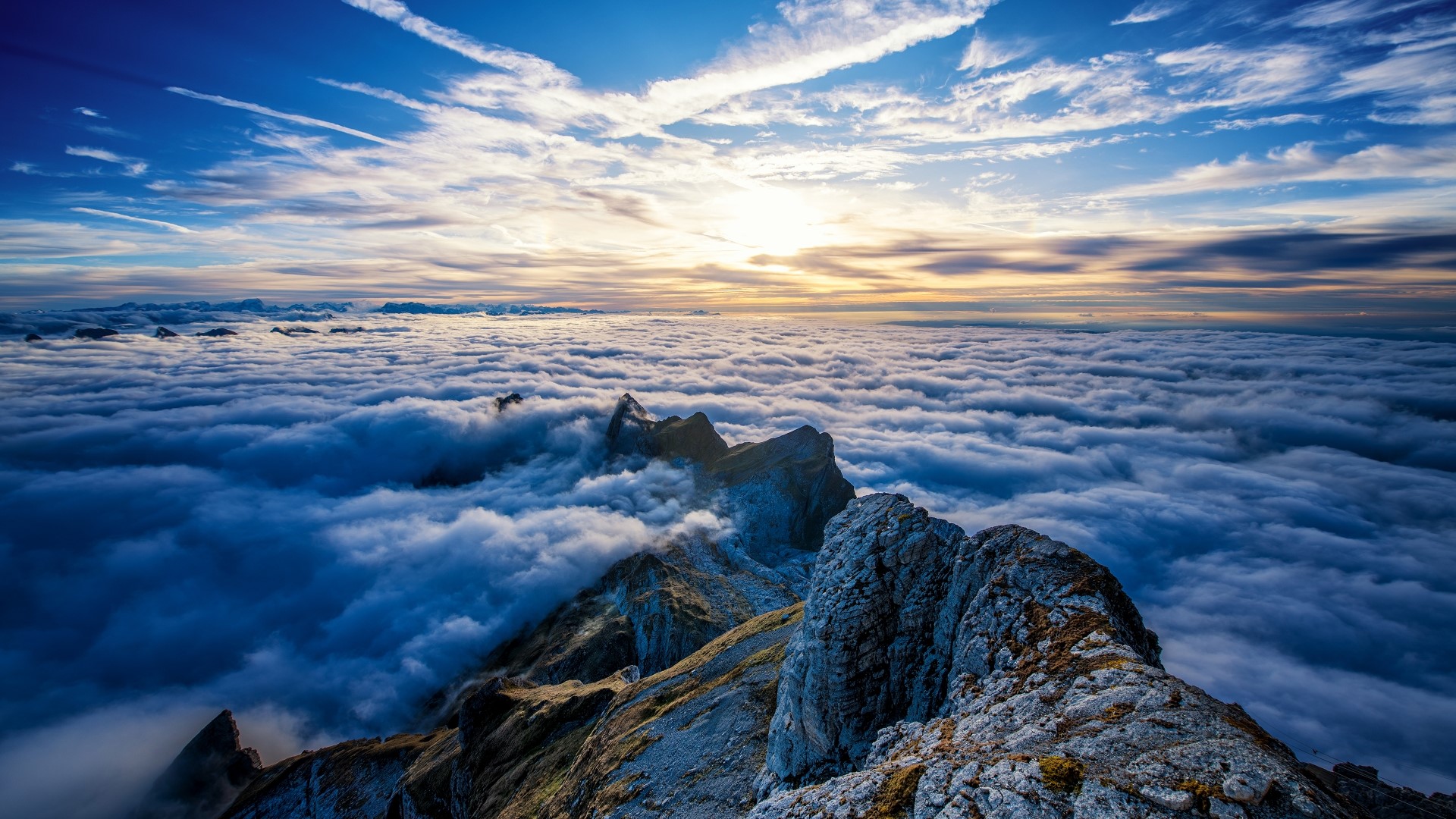Saentis Mountain above the clouds at sunrise HD Wallpaper