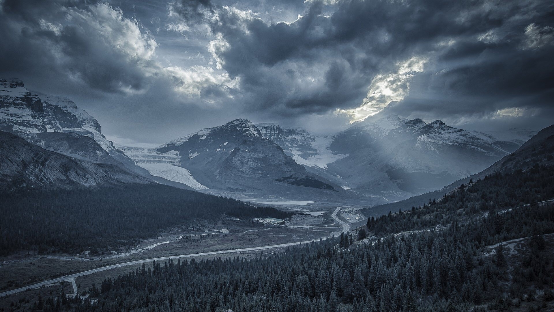 Mountain valley with glaciers and stormy clouds HD Wallpaper