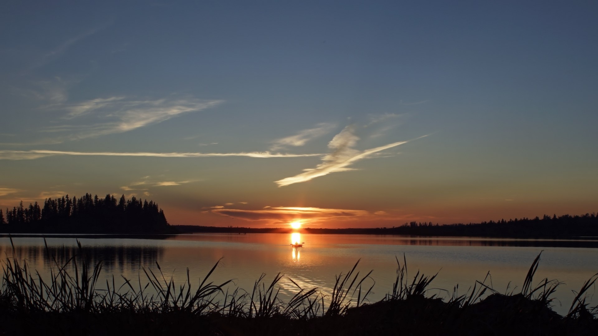 Sunset over a lake with a boat HD Wallpaper