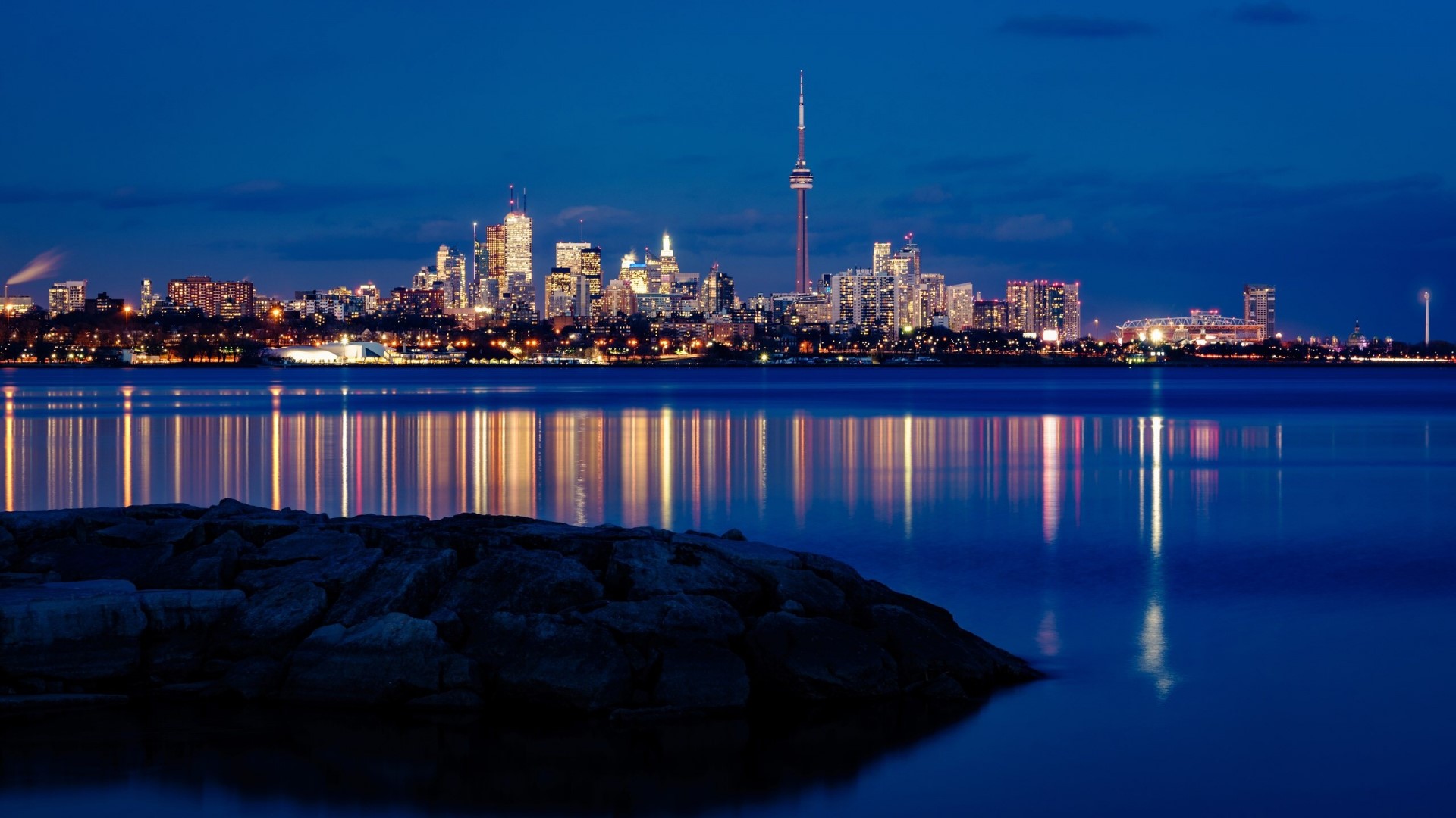 Toronto skyline at night with CN Tower and reflections HD Wallpaper