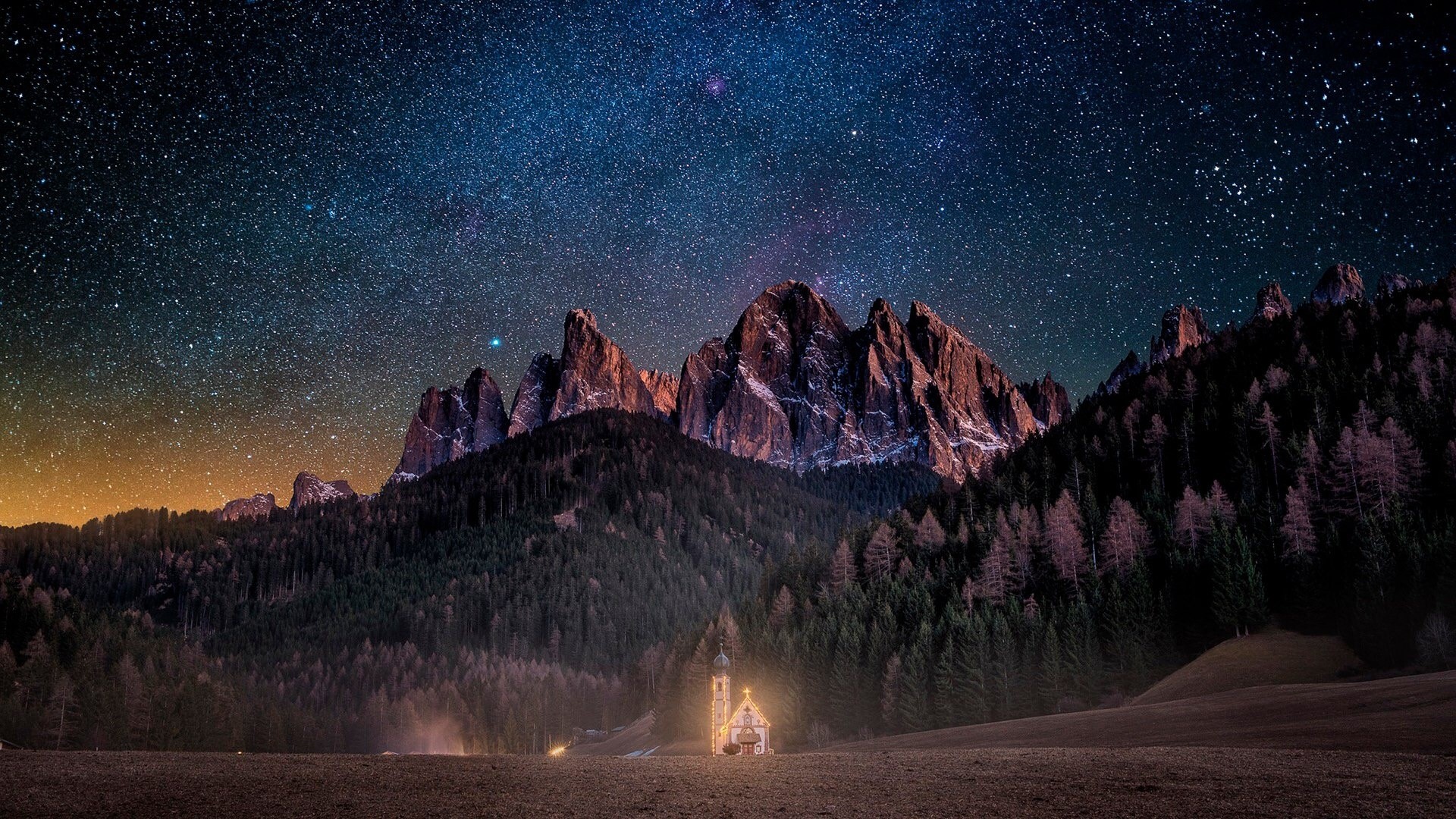 Church under starry sky in Dolomites HD Wallpaper