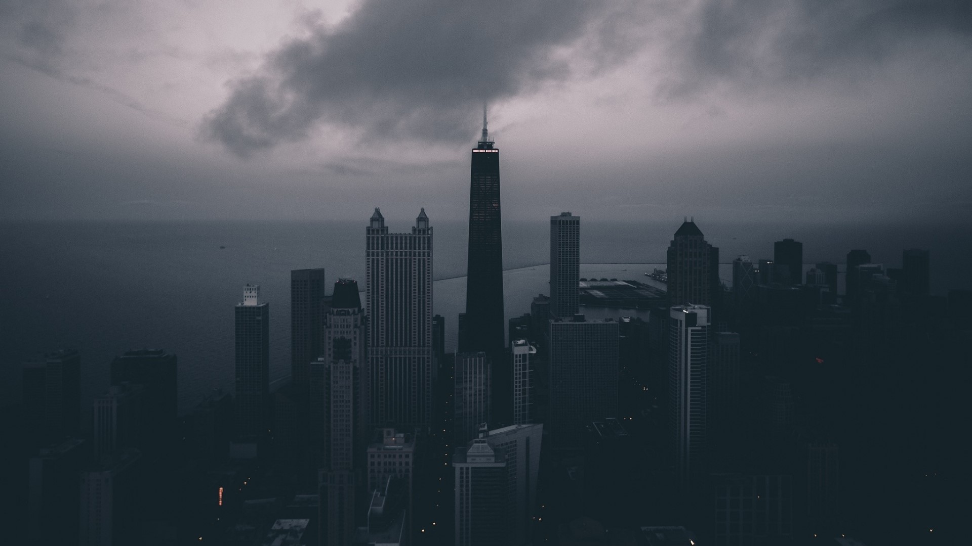 Cityscape with tall buildings and cloudy sky HD Wallpaper