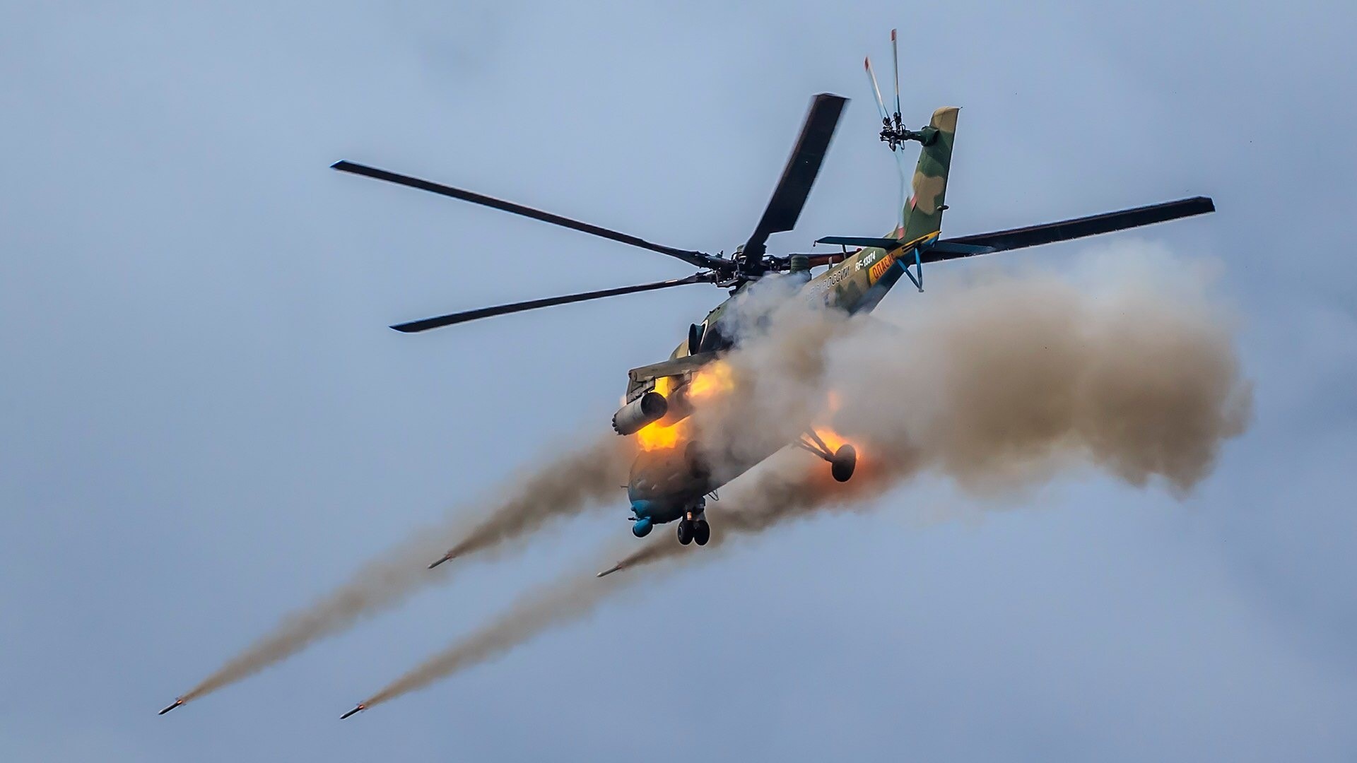 Mi-35M helicopter firing flares and missiles HD Wallpaper
