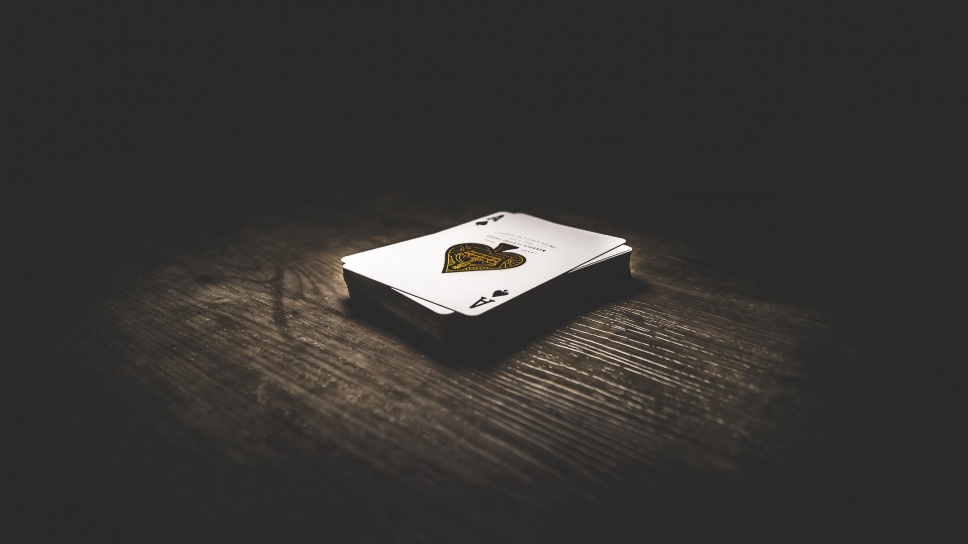 Deck of cards on a wooden table HD Wallpaper