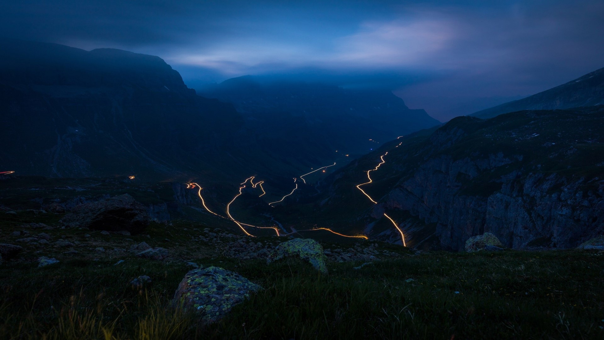 Light trails in mountains near Spiringen, Switzerland HD Wallpaper