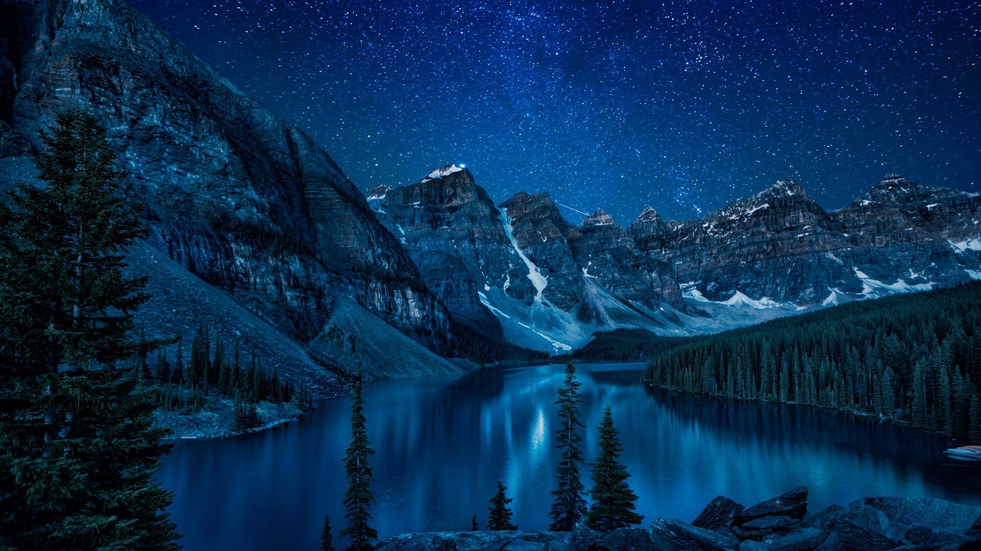 Moraine Lake at night under a starry sky HD Wallpaper