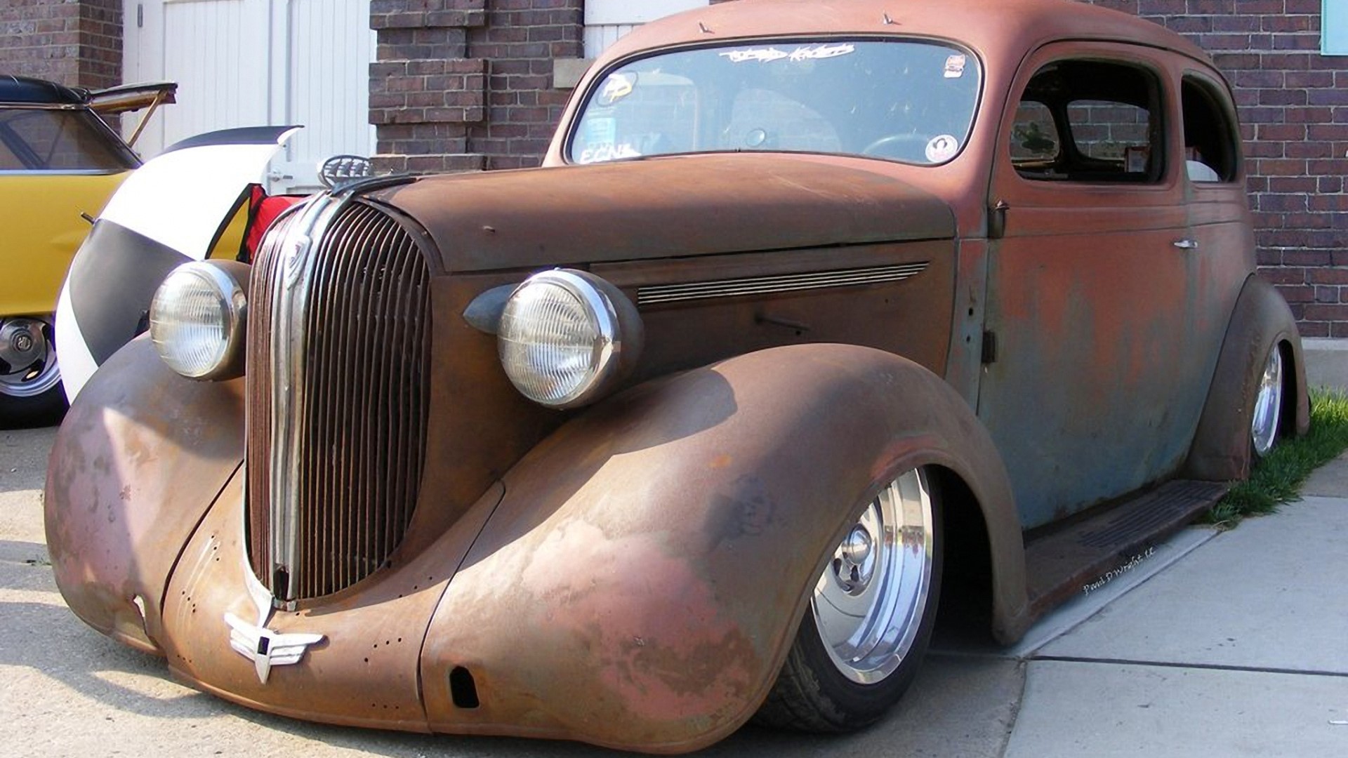 Rusty Rat Rod Sedan with Chrome Wheels HD Wallpaper