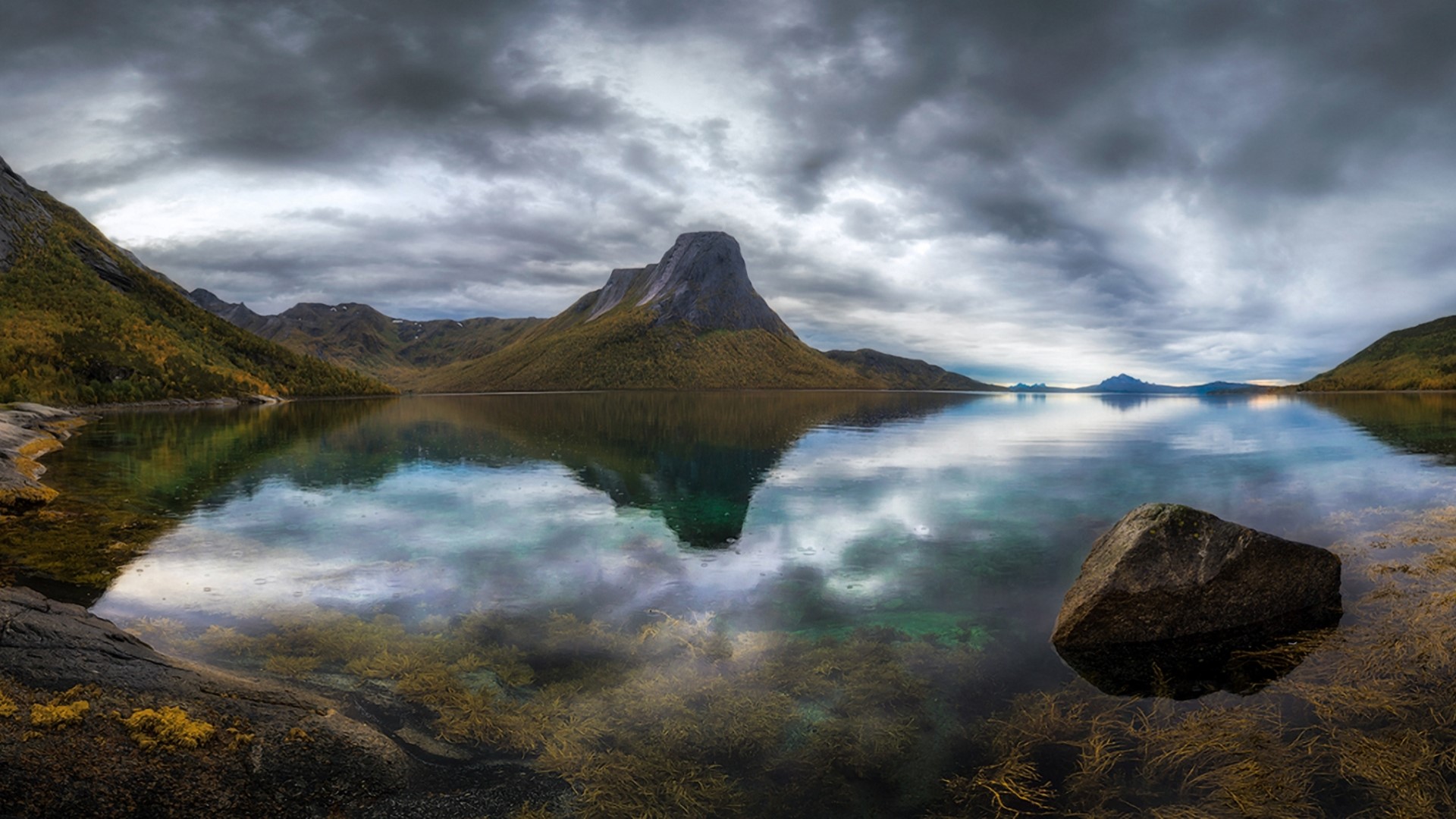 Mountain reflected in a lake under cloudy sky HD Wallpaper
