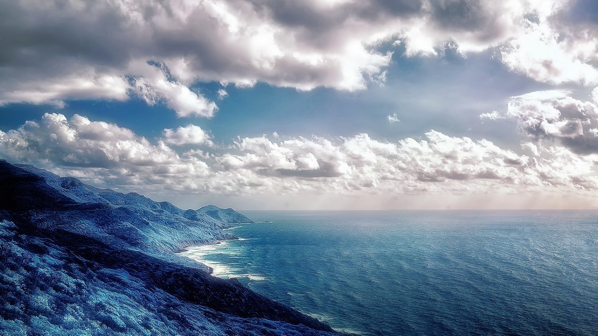 Blue Mountains meet the Sea under Cloudy Sky HD Wallpaper