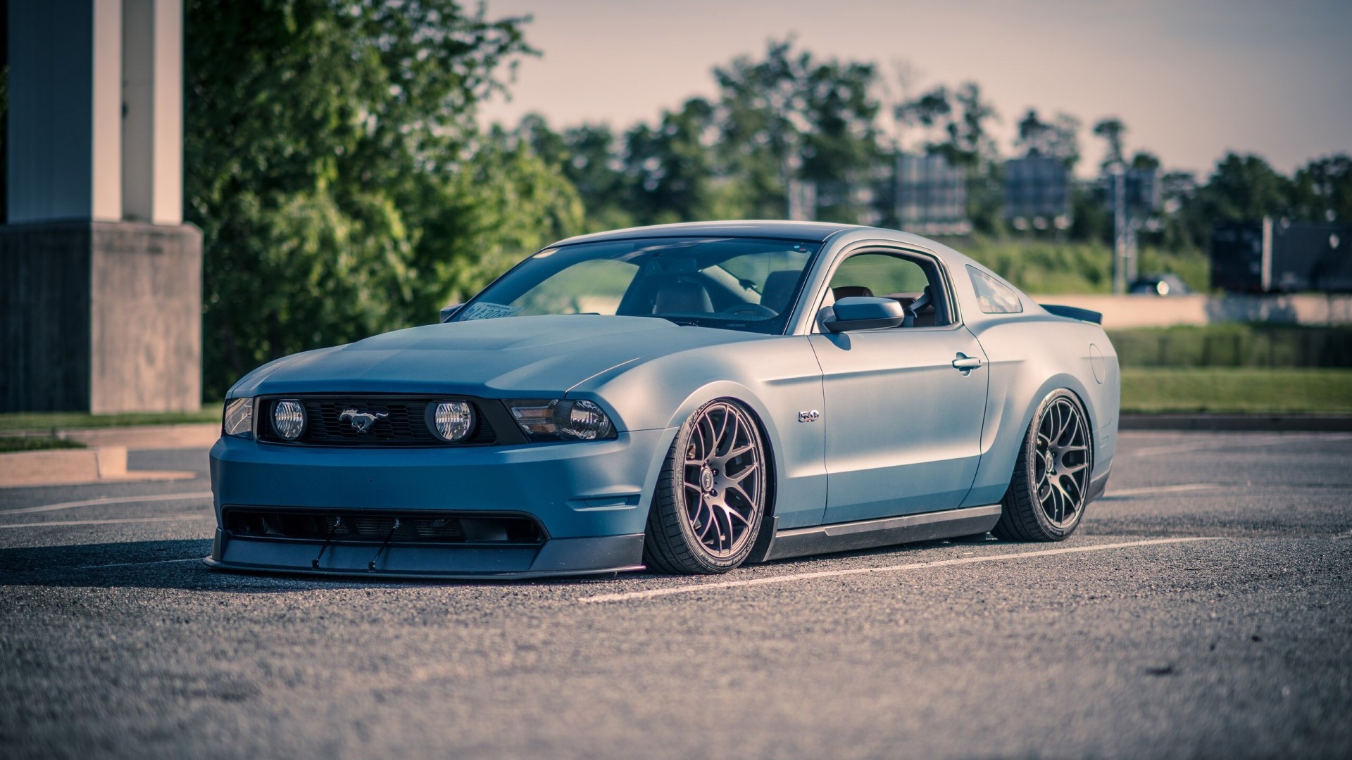 Blue Ford Mustang parked in a lot HD Wallpaper