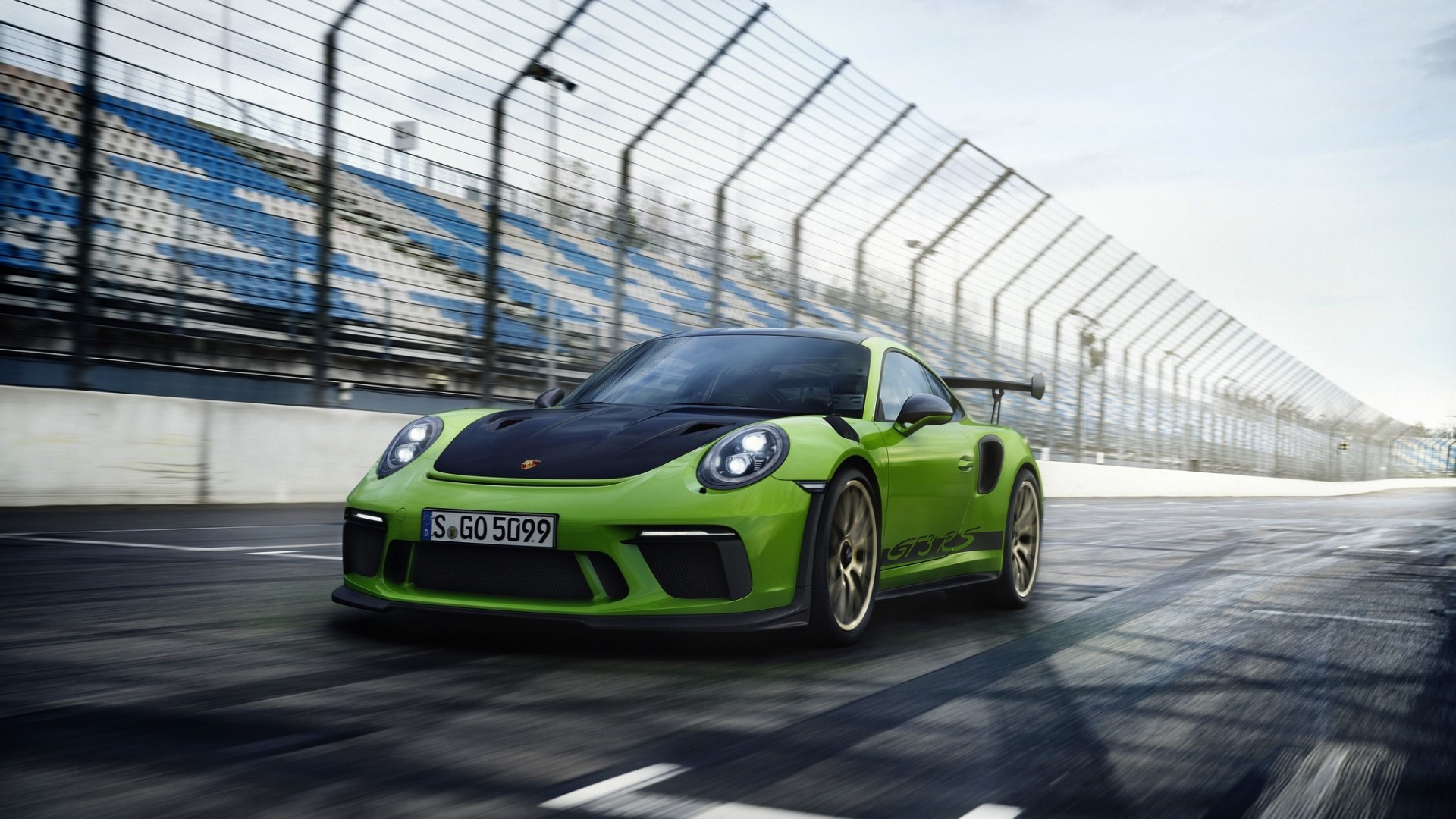 Green Porsche 911 GT3 RS on a Racetrack HD Wallpaper