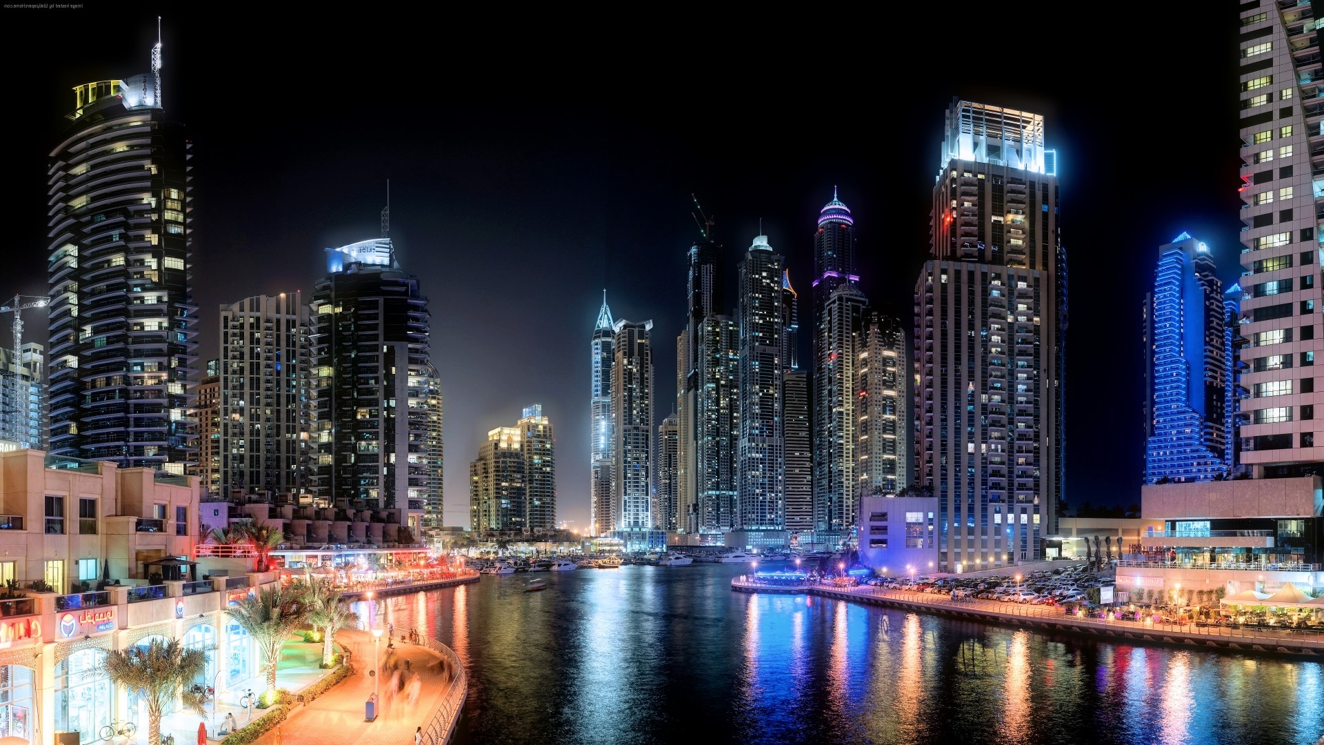 Cityscape at Night with Skyscrapers and Waterway HD Wallpaper